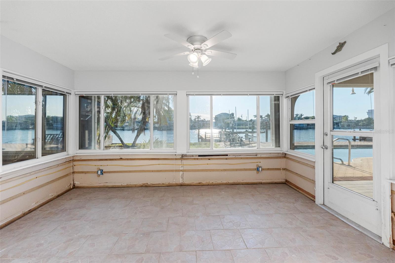 Sunroom/office connects from dining room and open to lanai.