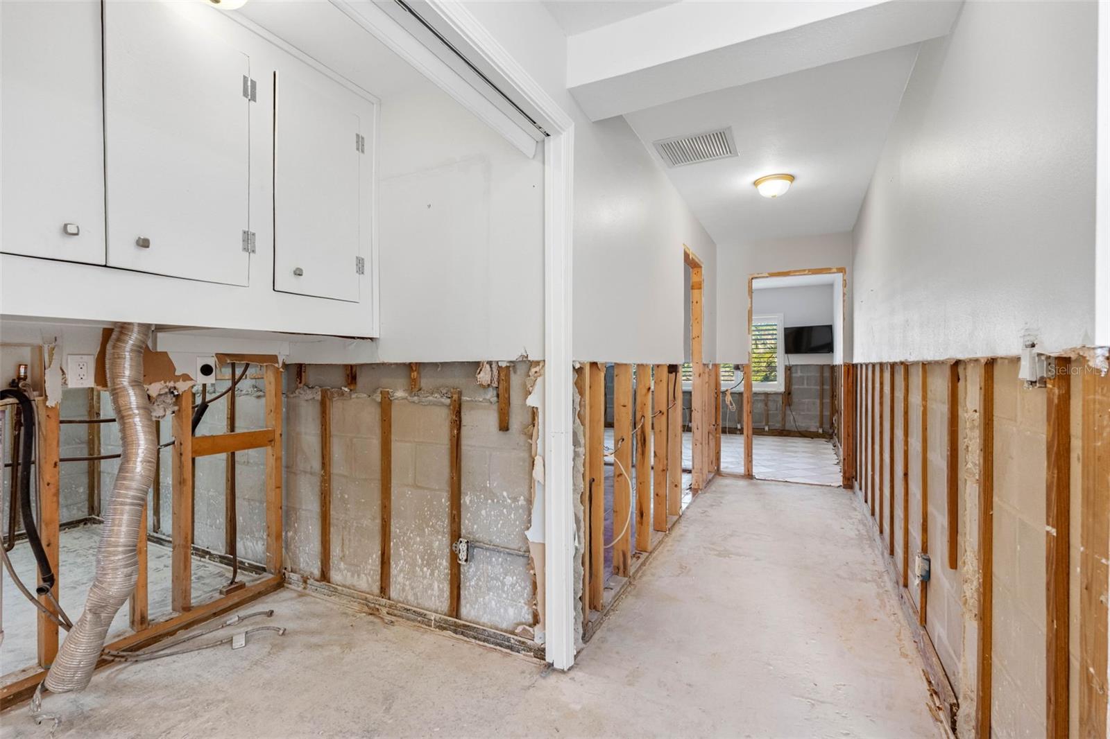 Hallway to two bedrooms.  Indoor washer and dryer.