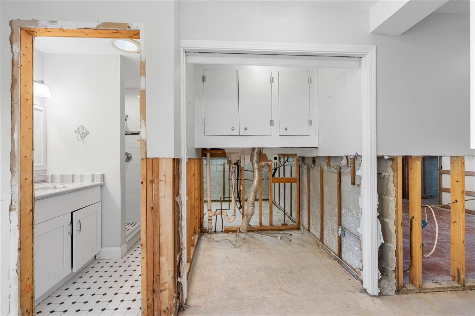 Laundry room and full bathroom.