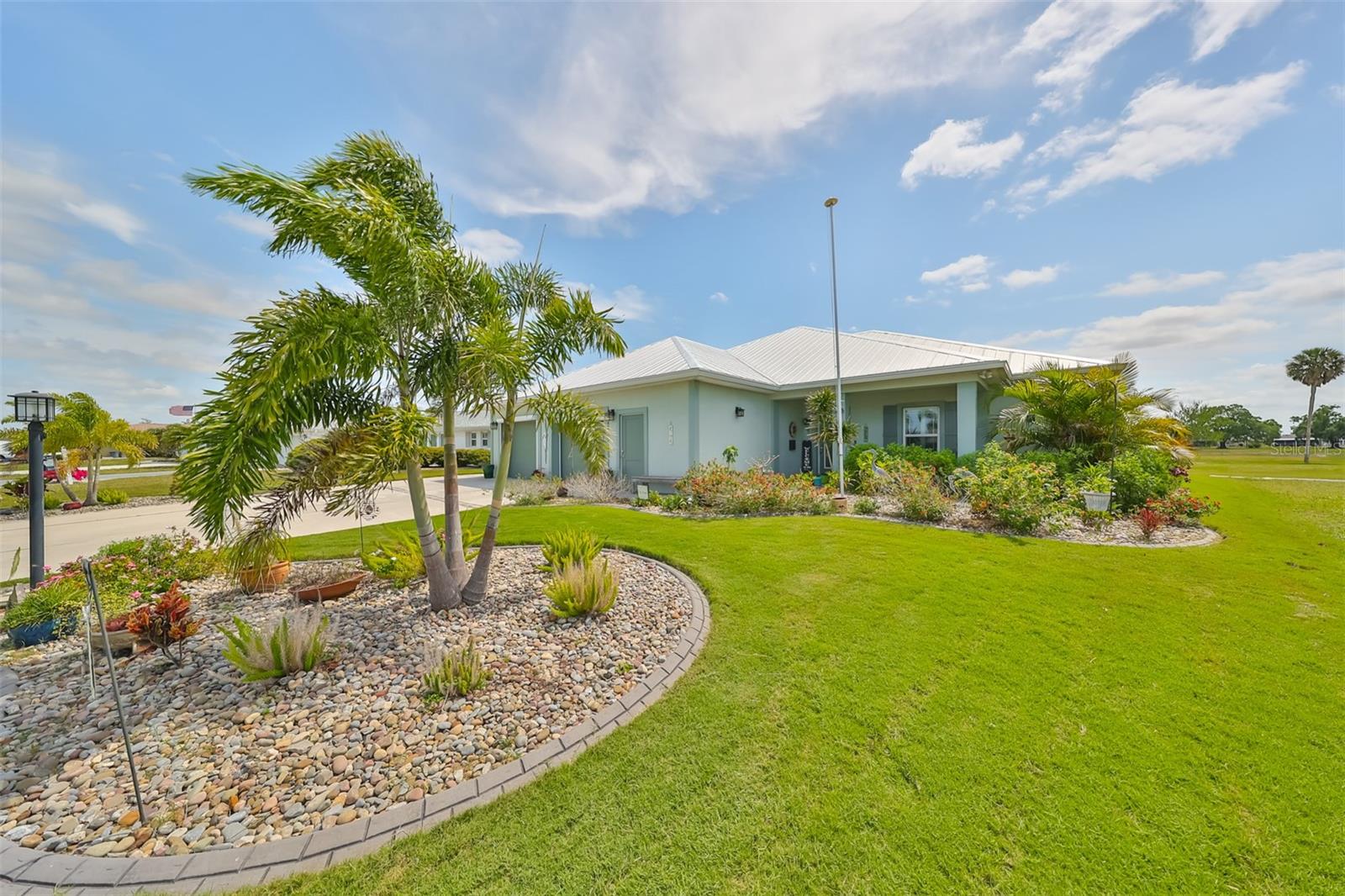 Contemporary looking home and easy maintenance landscaping with new sod.