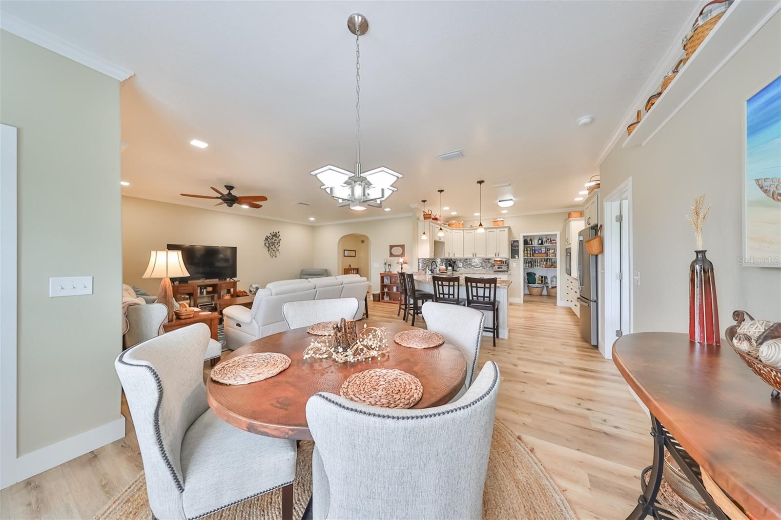 The dining room and living room are separated by a small interior wall to break up the space a little, while still being completely open to both the kitchen and living rooms.