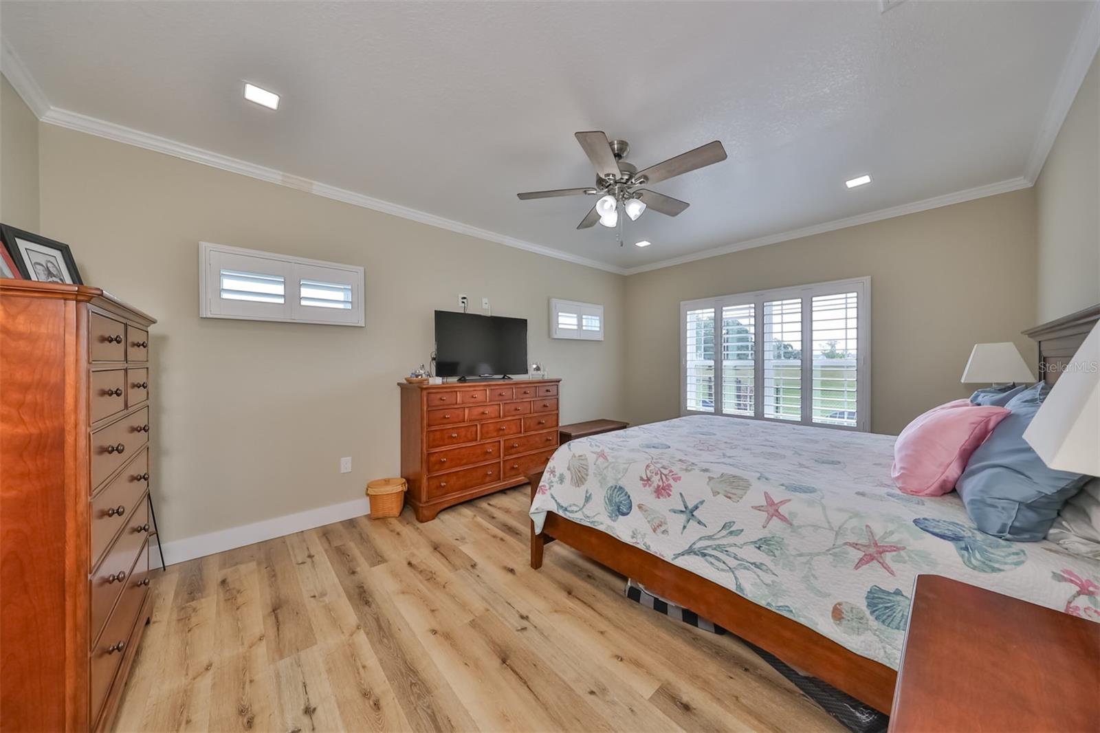 Primary bedroom is bright with lots of natural Florida sunshine.