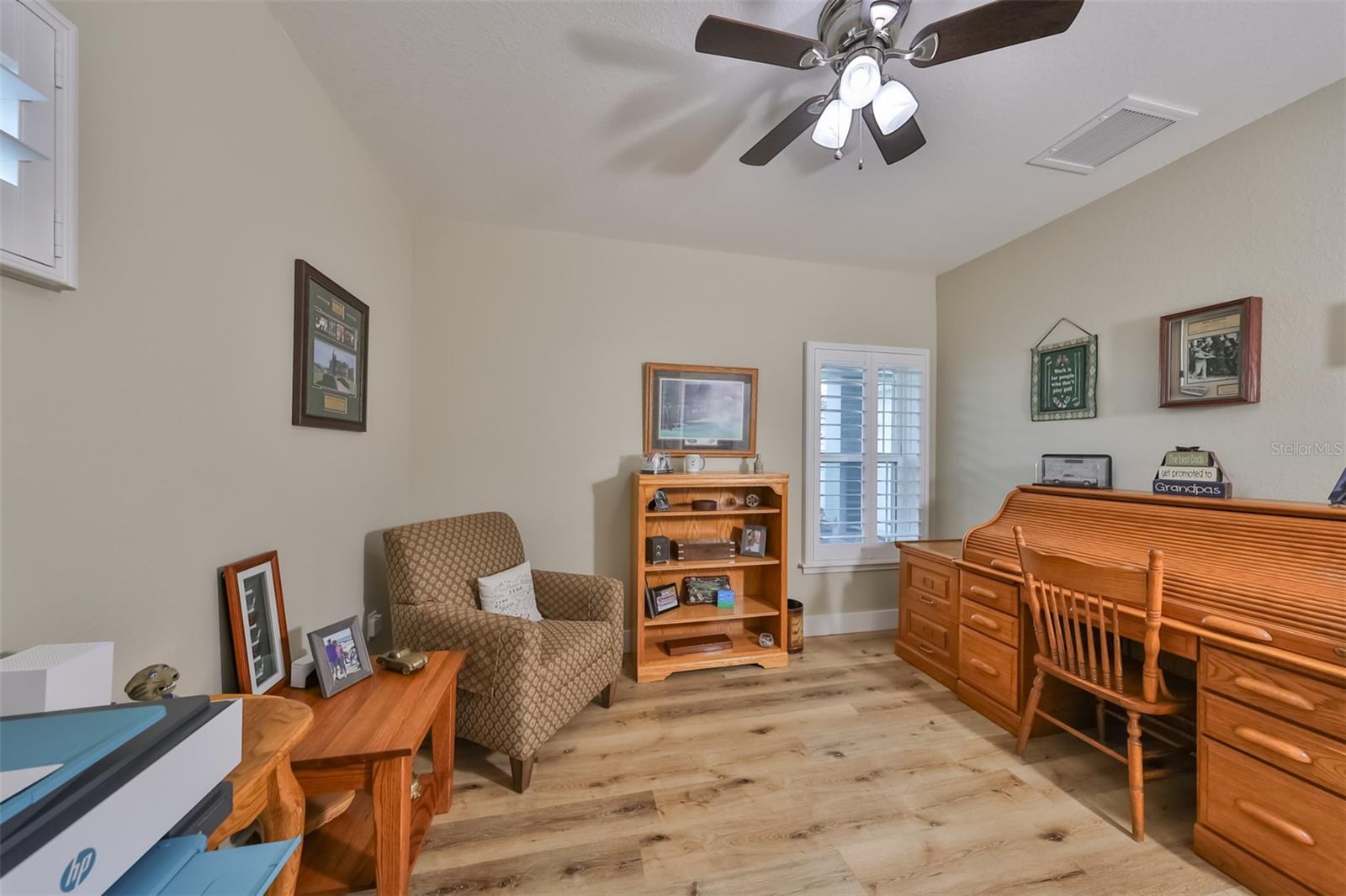 This space can be used an either an Office or another bedroom. Complete with matching wood floors and double door closet.