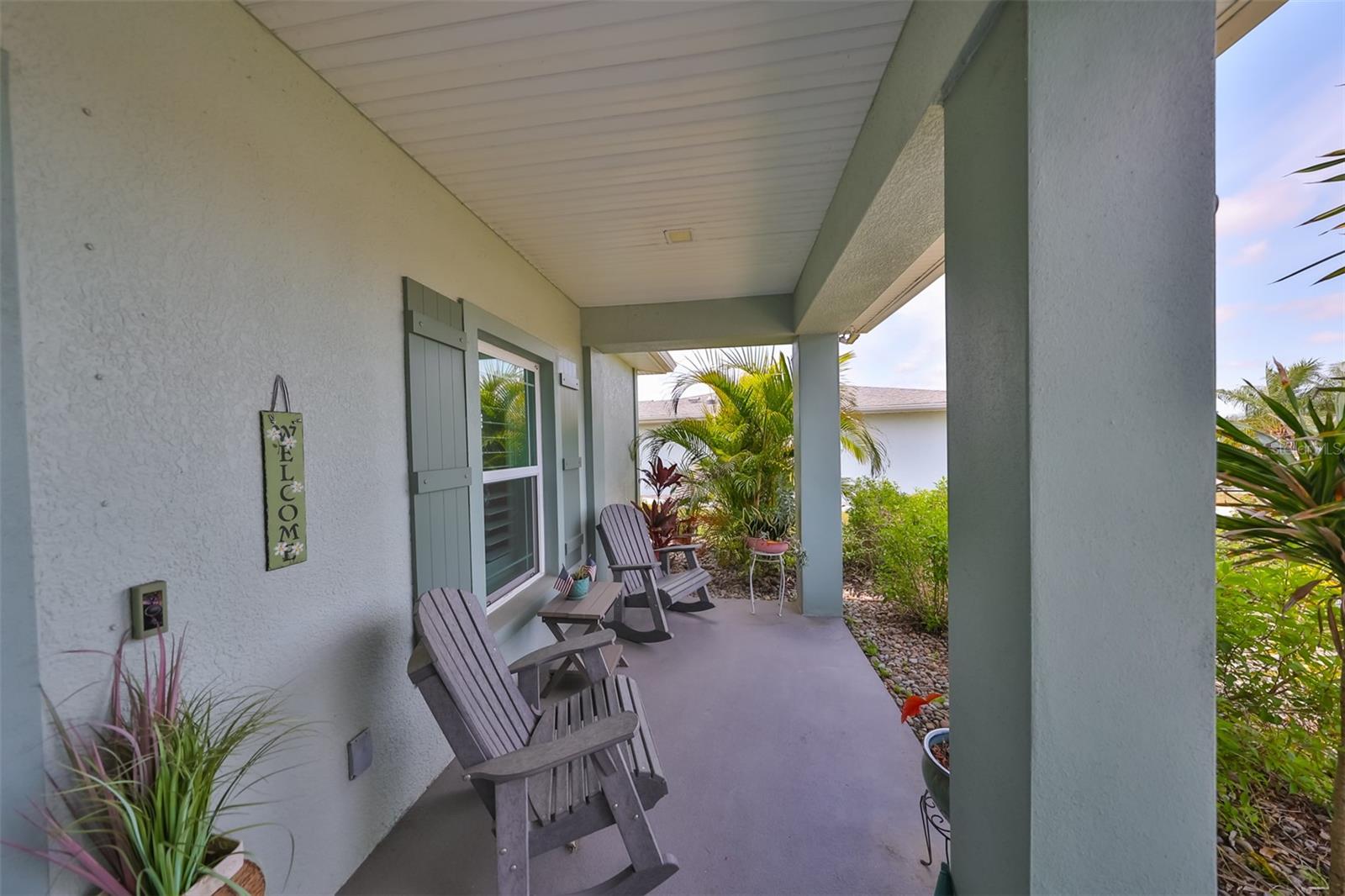 Another view of the covered front porch entrance with ample room for patio furniture.