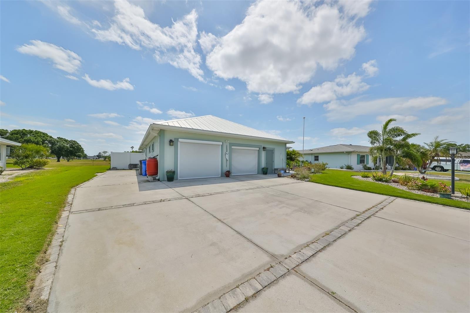 Side carport with RV hook up attachment and sewer line.