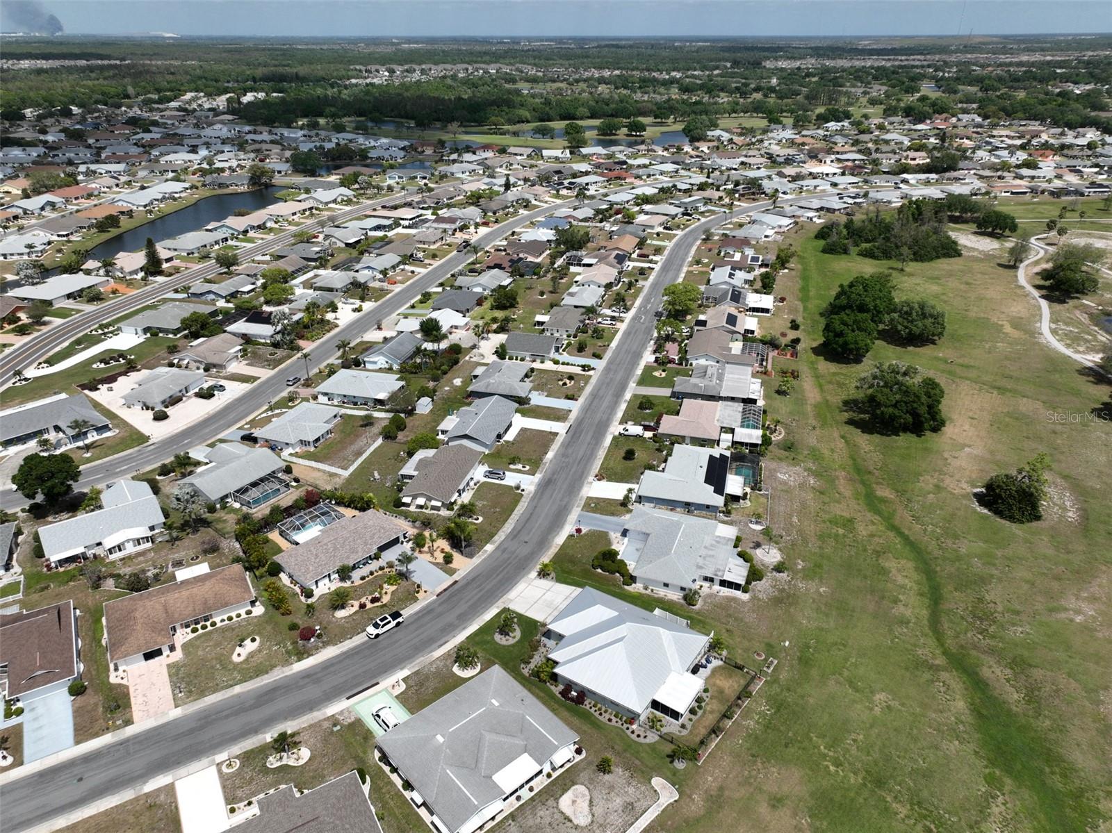 Ariel view of home, outlined with a red arrow.