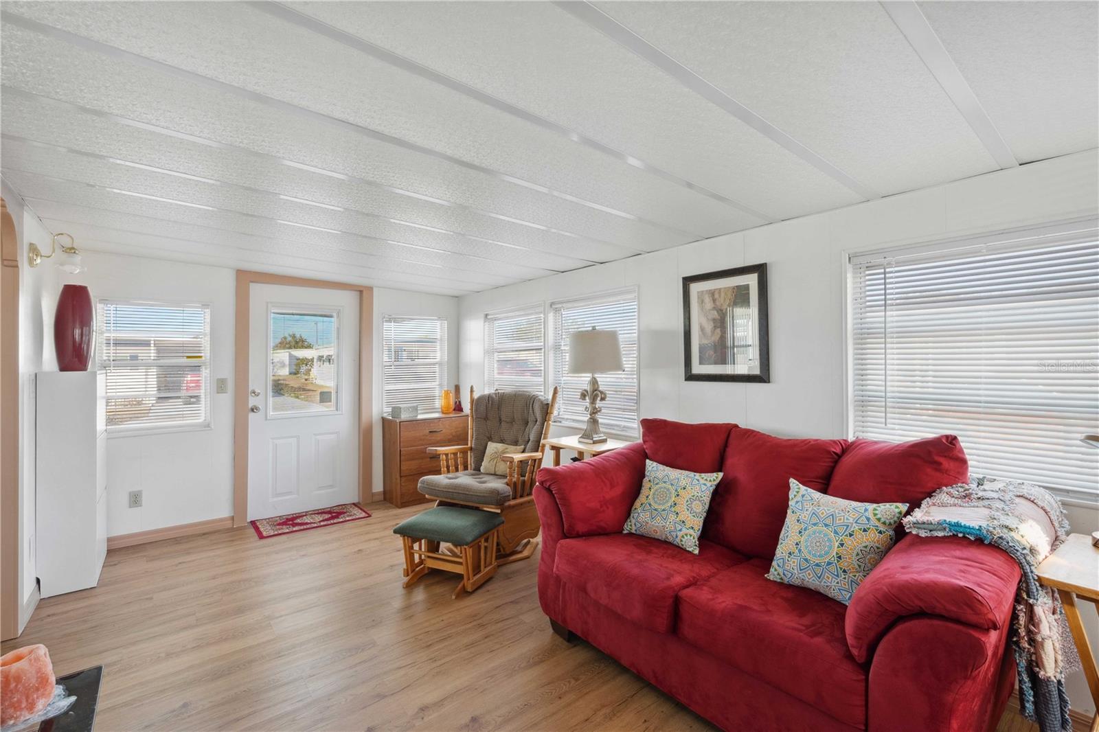 Living room opens to dining area