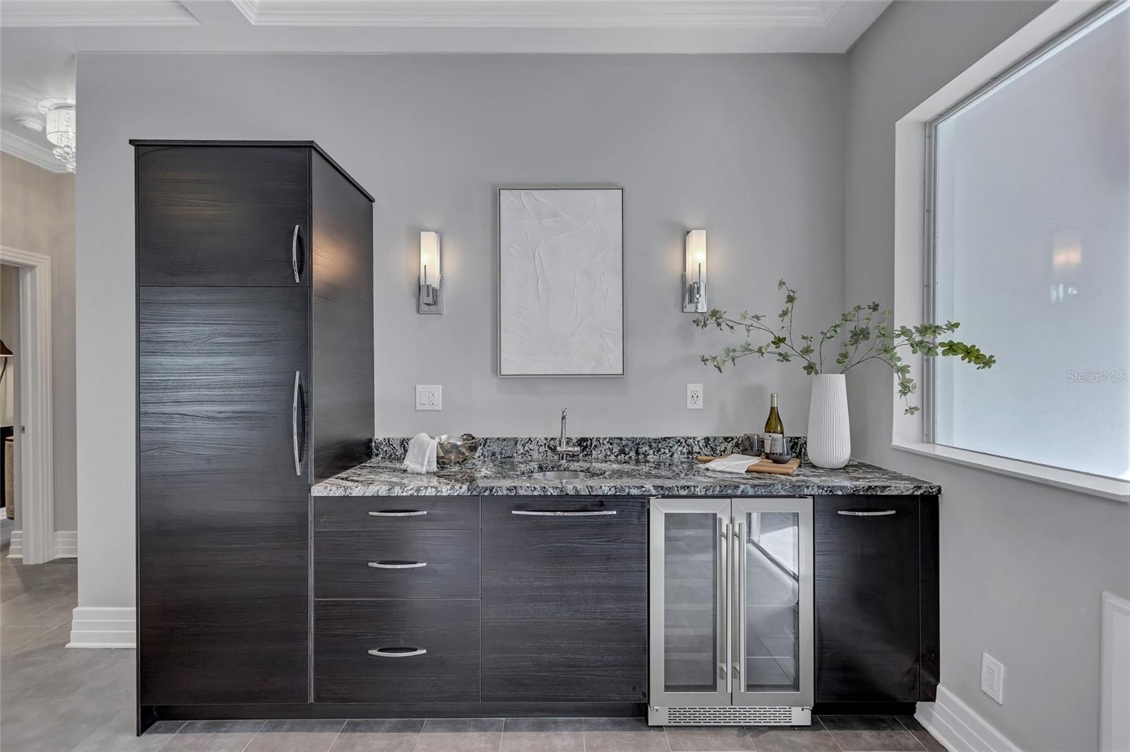 Wet bar with beverage fridge and pantry