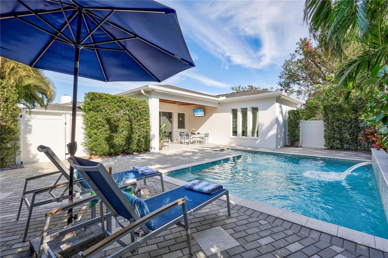 Private saltwater pool with waterfall feature