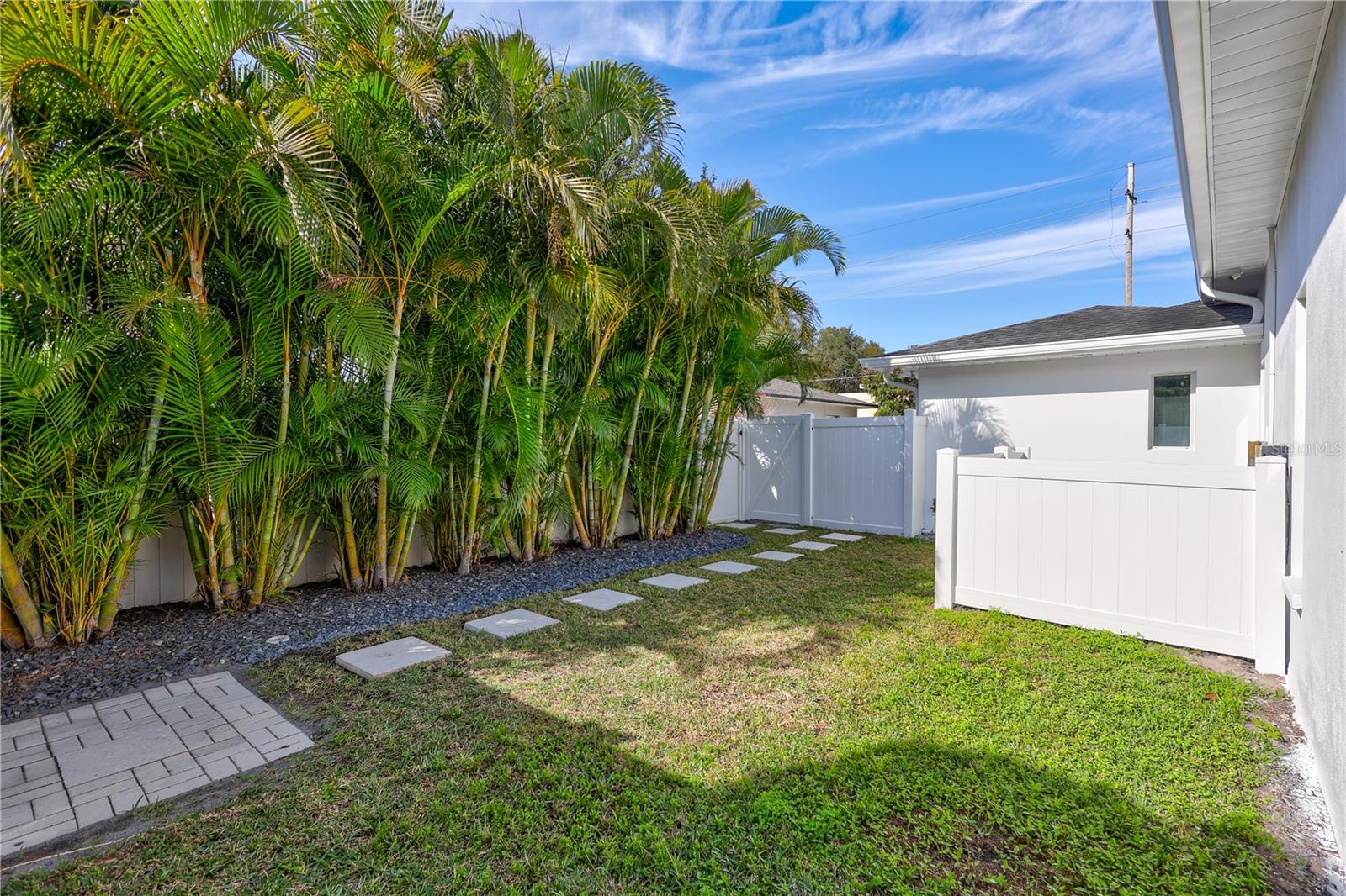 Fenced yard away from pool area