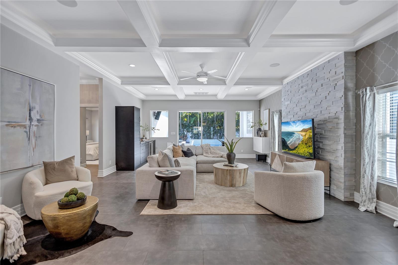 What a grand family room w/ 10' coffered ceilings