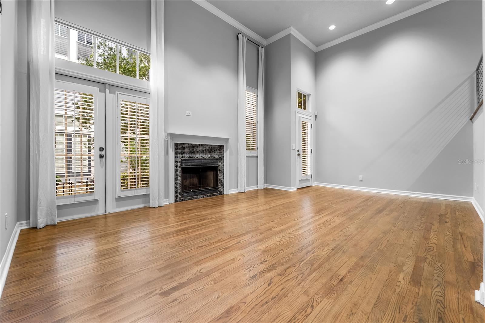 GreatRoom With Wood Burning Fireplace and French Doors