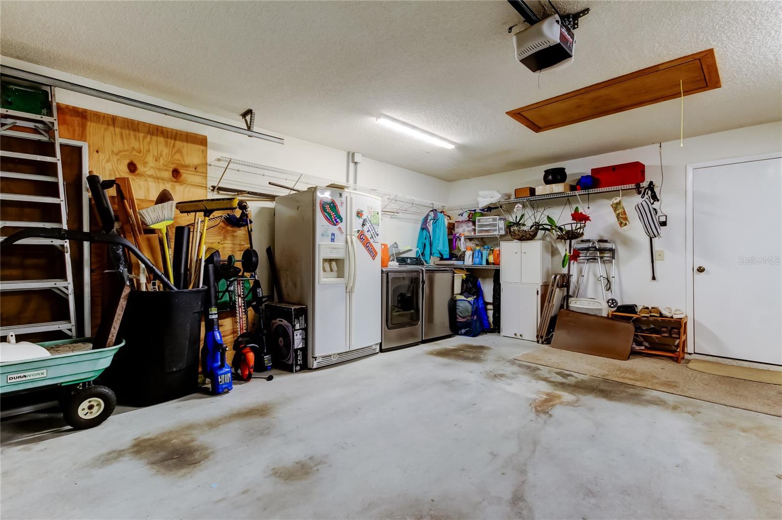 2 car garage, washer and dryer conveys. It can be moved back into the kitchen area.