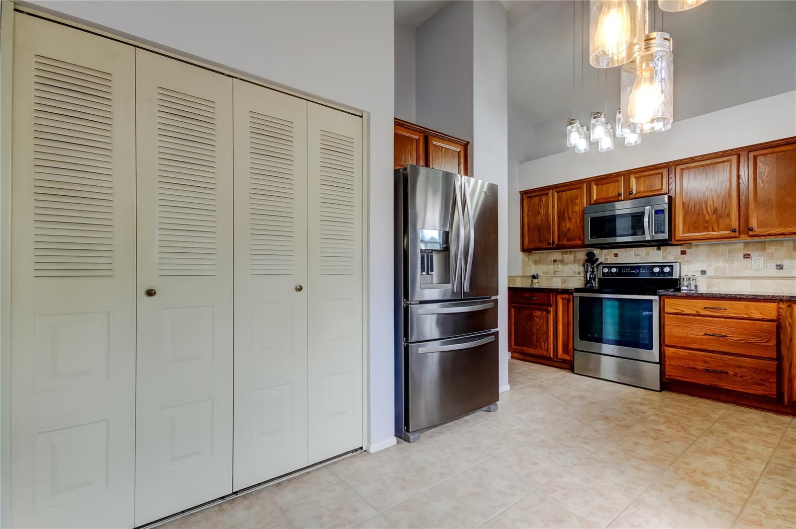 Spacious pantry area in the kitchen but can also put the washer/dryer back into this space.