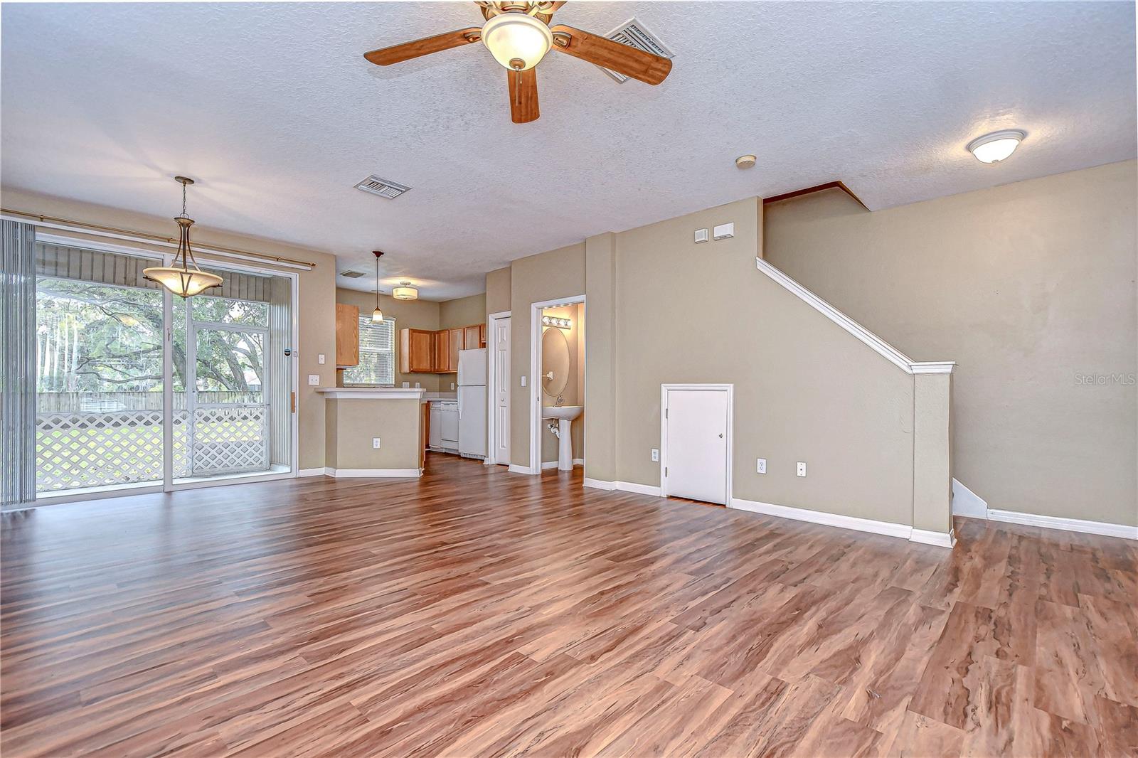 Living room with lanai access through sliding glass doors!