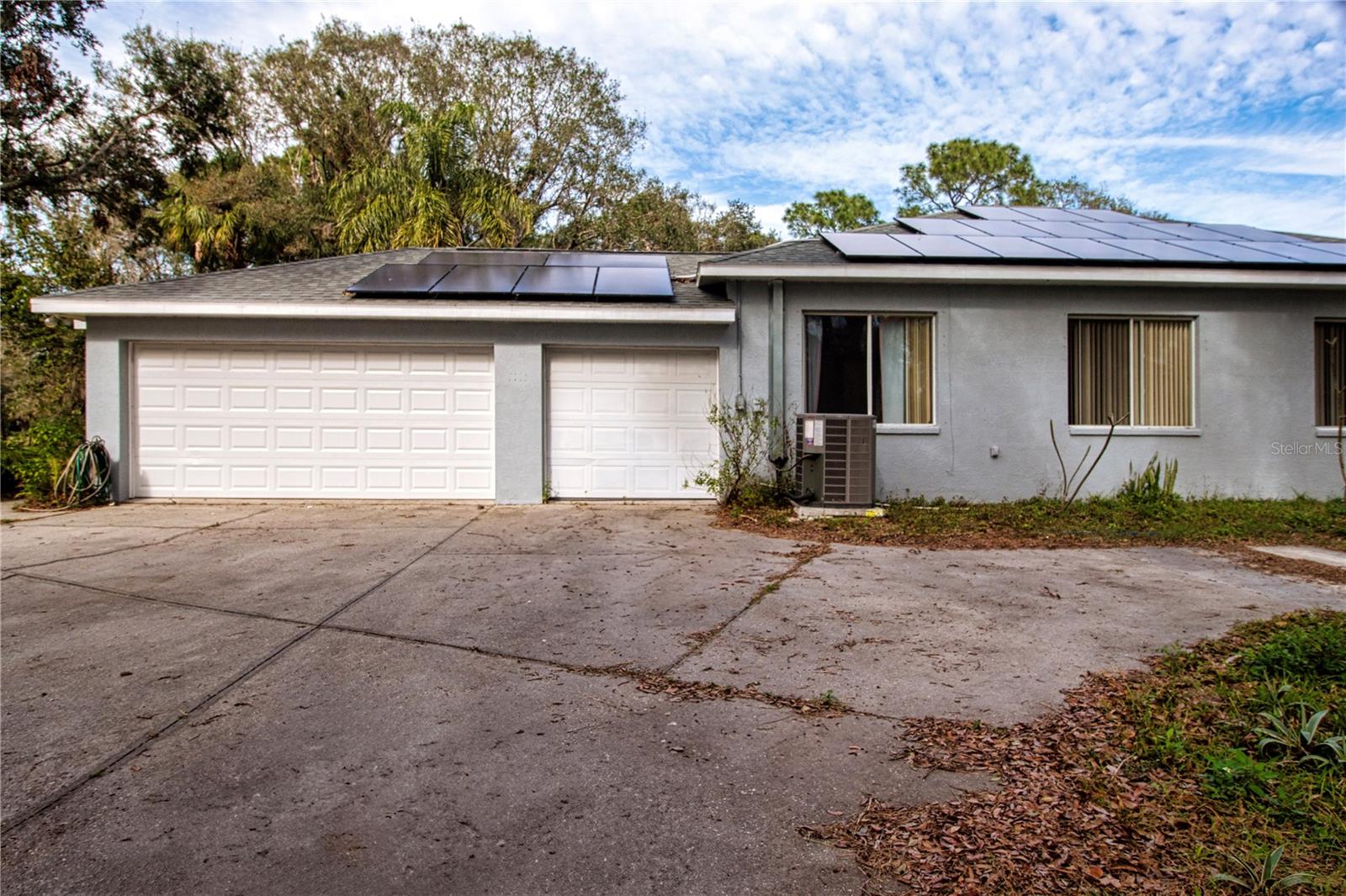 View Of 3 Car Garage Located To The Side Of Home Parking for RV Or Boat