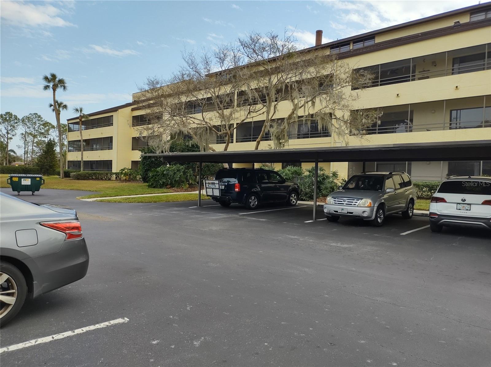 Rear of Building with assigned parking space under carport