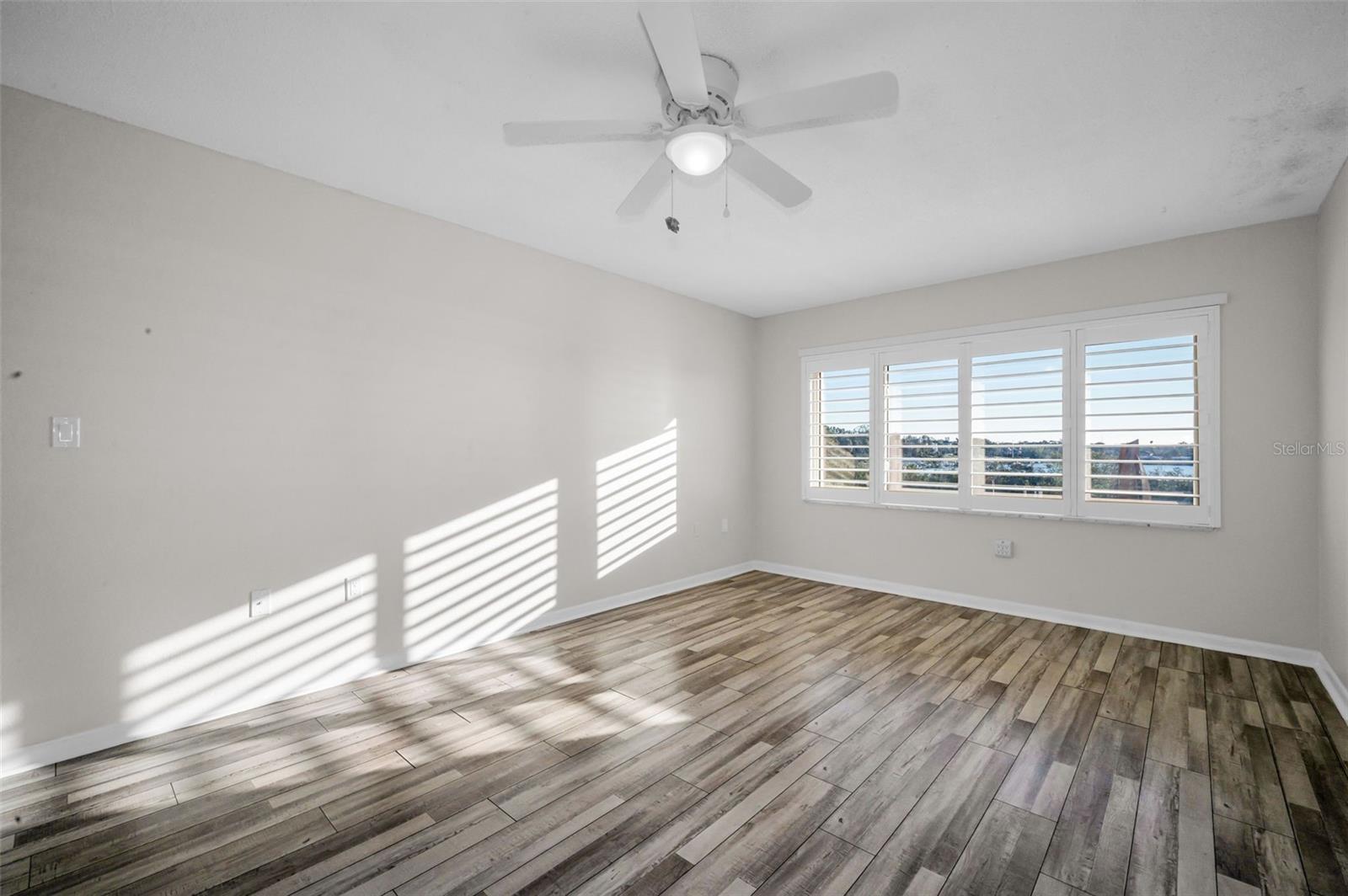 Custom shutters in primary bedroom