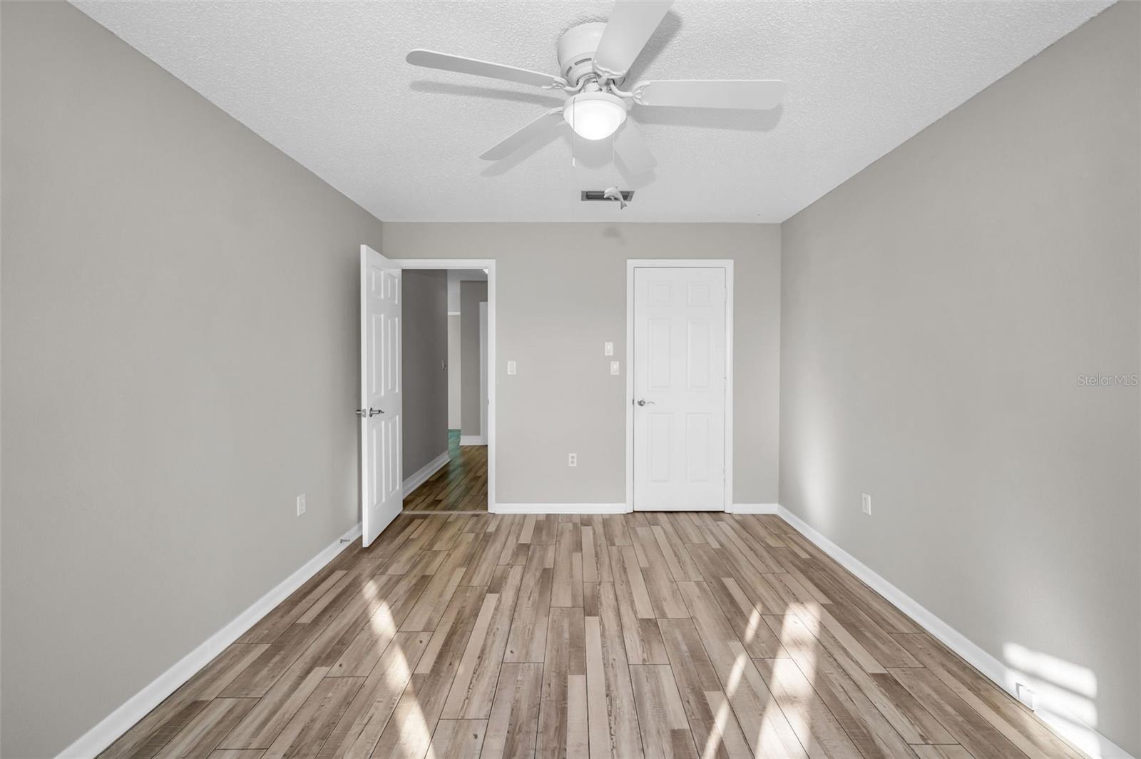 Spacious guest bedroom with closet