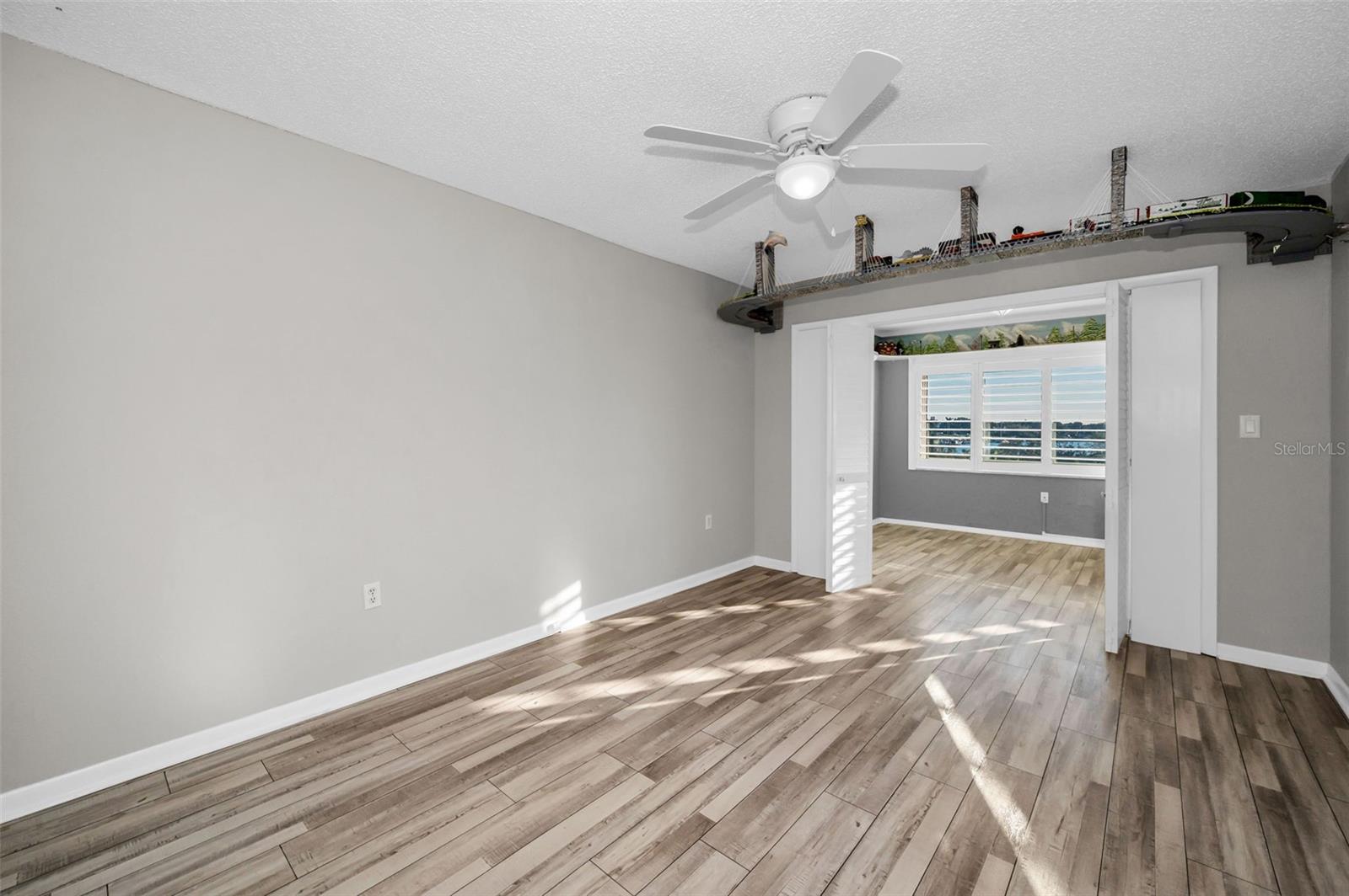 Guest bedroom with doors to office/den