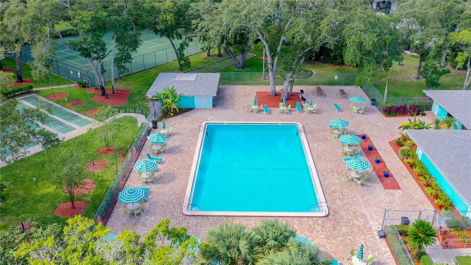 Aerial View of Pool (Tennis/Pickleball Courts and Shuffleboard on left)