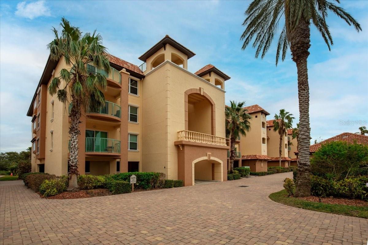 Tuscan-influenced colors with red tile roof unit has 2 balconies one Sunrise one Sunset. Also featuring underbuilding assigned parking