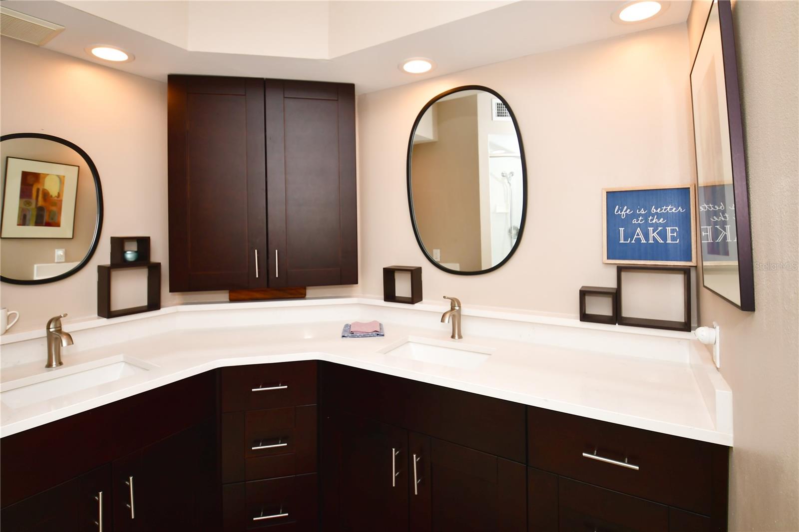 Dual sinks and lots of storage in primary bathroom