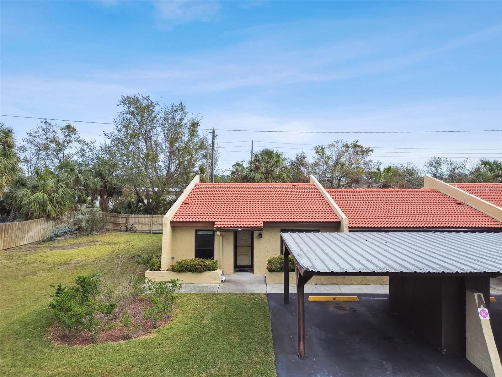 Covered Carport with Storage Shed