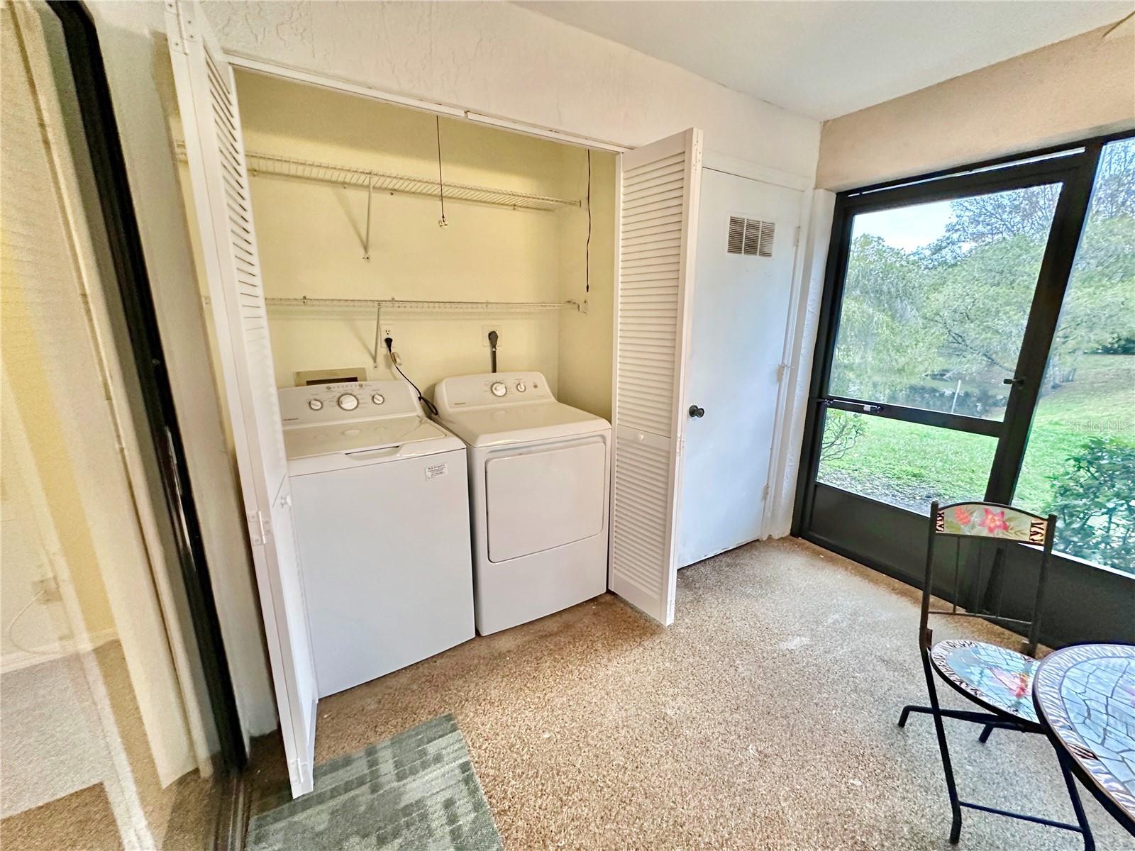 Washer and Dryer closet along with utility closet off screened porch