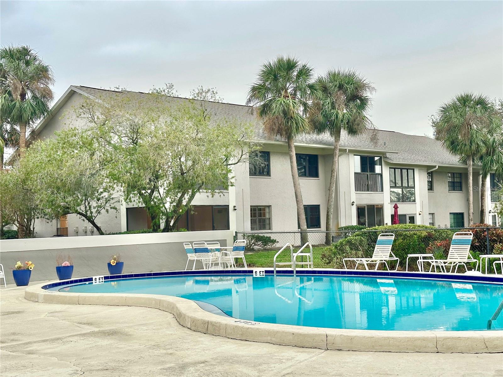 Community pool with your corner unit in background