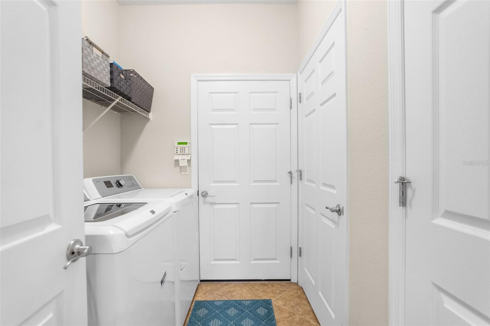 laundry leading to 3 car garage