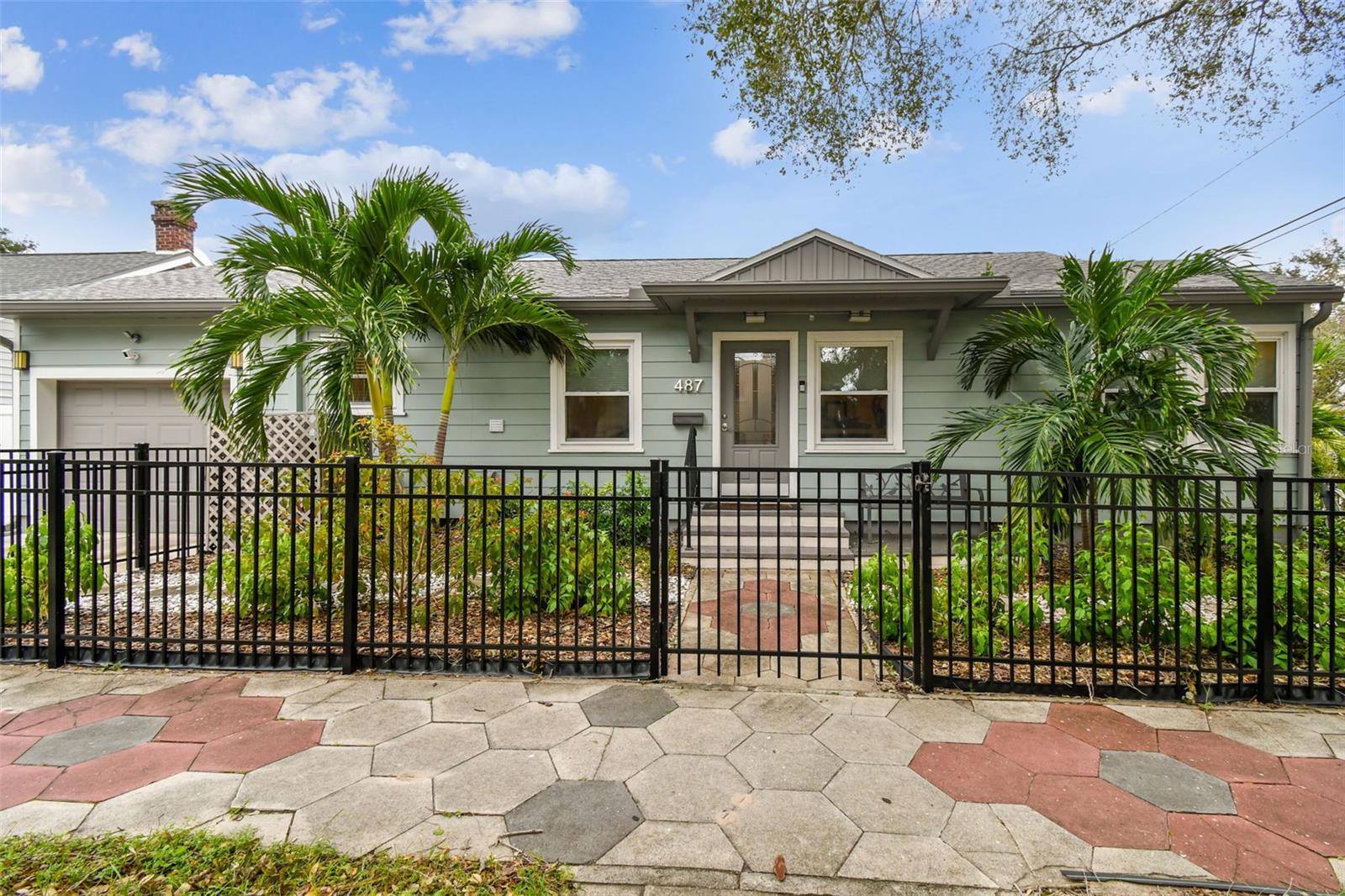 Beautiful front entrance and classic black iron fence