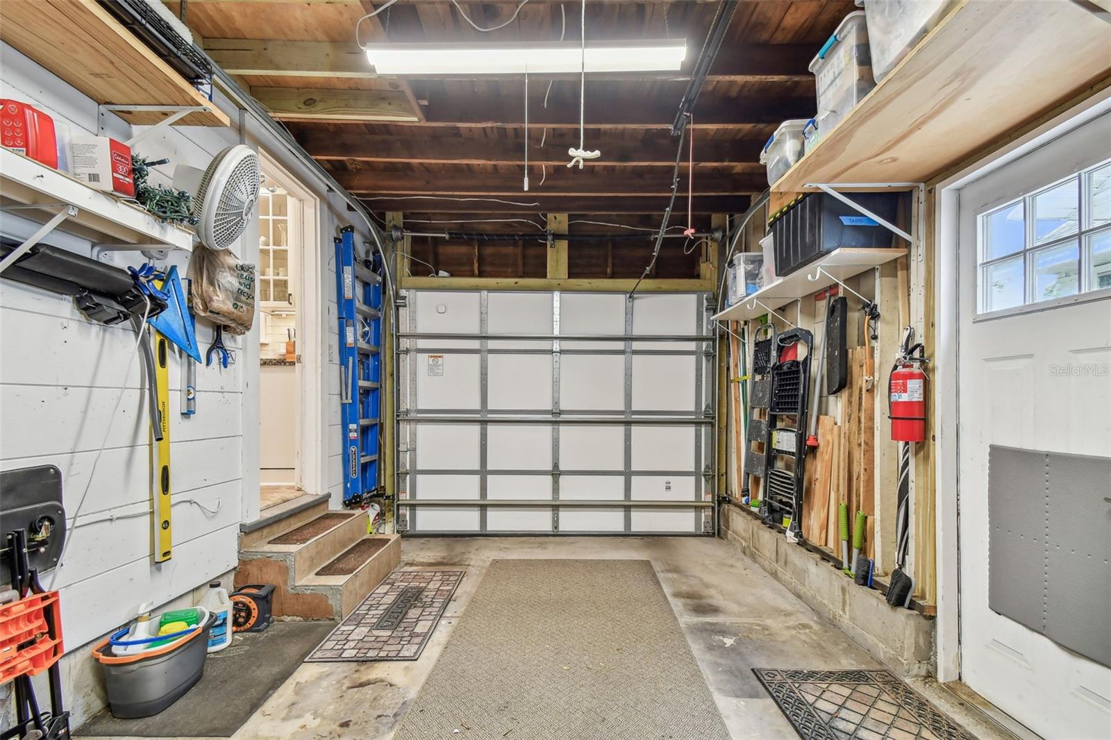 Attached garage holds mid size car or SUV  and extra storage space