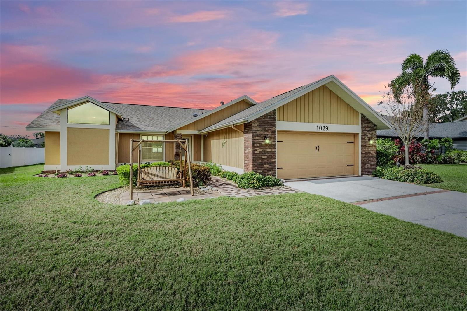 Located in Falcon Ridge - Homes RARELY come up for sale in this HIGHLY sought after Palm Harbor neighborhood!  This large BLOCK home has a wonderful open floor plan, with 3 bedrooms, 2 bathrooms, plus A FLEX SPACE (great for an office/study, playroom, game room, craft room), INSIDE laundry room, and a 2-car garage wired for an electric car charger! NEW ROOF 2024, NEW AC 2021, NEW WATER HEATER 2022, NEW EXTERIOR PAINT.  In addition, this lovely home is approximately 60 Feet Above Sea Level in a NON-EVACUATION ZONE and NO FLOOD ZONE