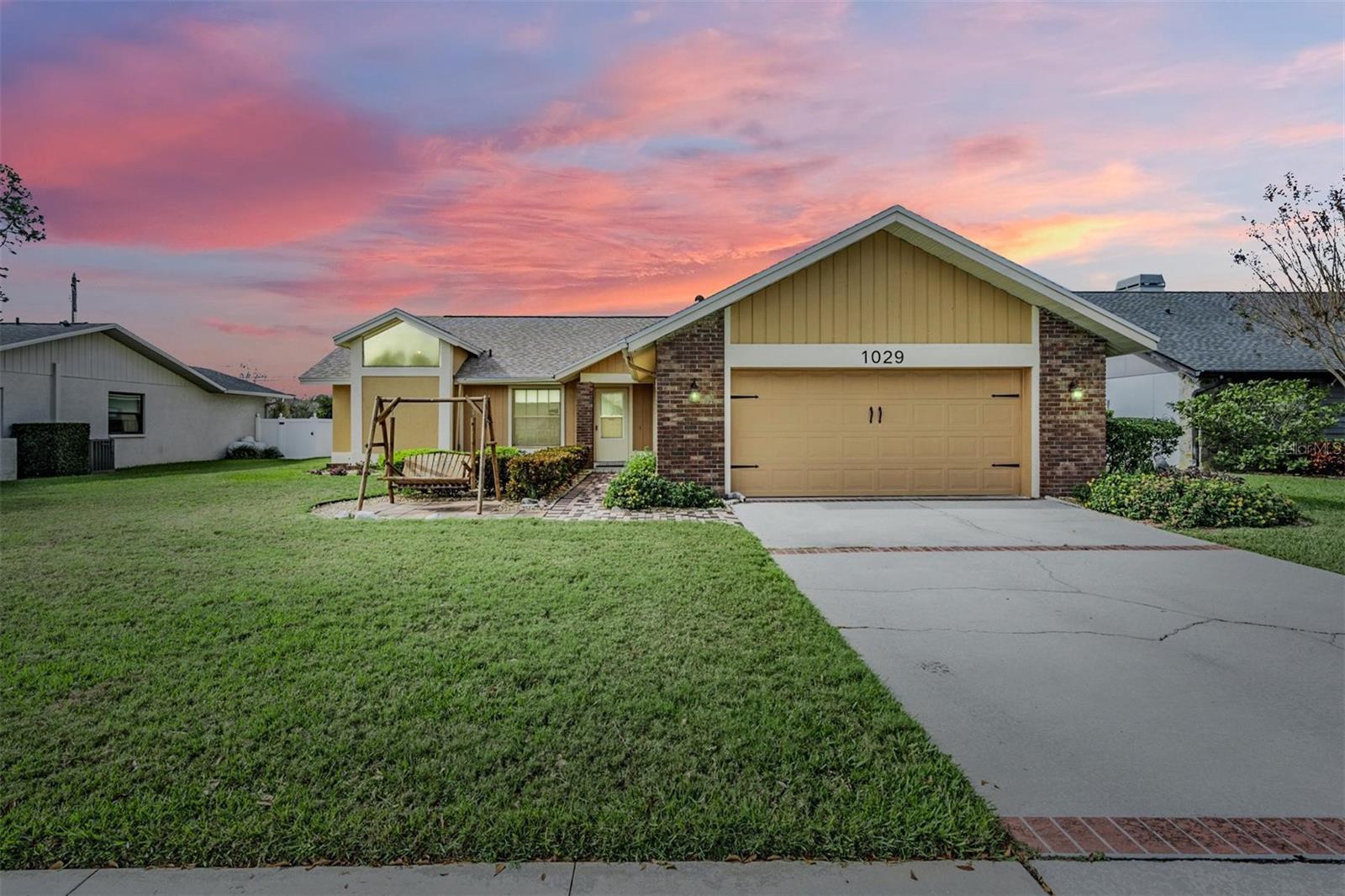 Located in Falcon Ridge - Homes RARELY come up for sale in this HIGHLY sought after Palm Harbor neighborhood!  This large BLOCK home has a wonderful open floor plan, with 3 bedrooms, 2 bathrooms, plus A FLEX SPACE (great for an office/study, playroom, game room, craft room), INSIDE laundry room, and a 2-car garage wired for an electric car charger! NEW ROOF 2024, NEW AC 2021, NEW WATER HEATER 2022, NEW EXTERIOR PAINT.  In addition, this lovely home is approximately 60 Feet Above Sea Level in a NON-EVACUATION ZONE and NO FLOOD ZONE!