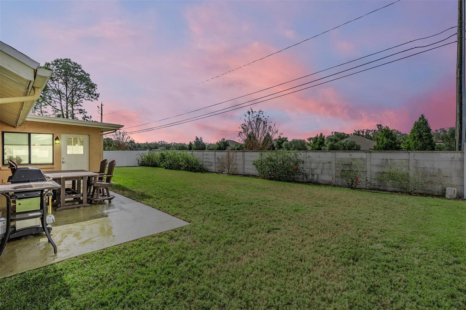 Back yard: Enjoy grilling or playing some outdoor games while you enjoy the stunning Florida sunset colors that paint the sky!