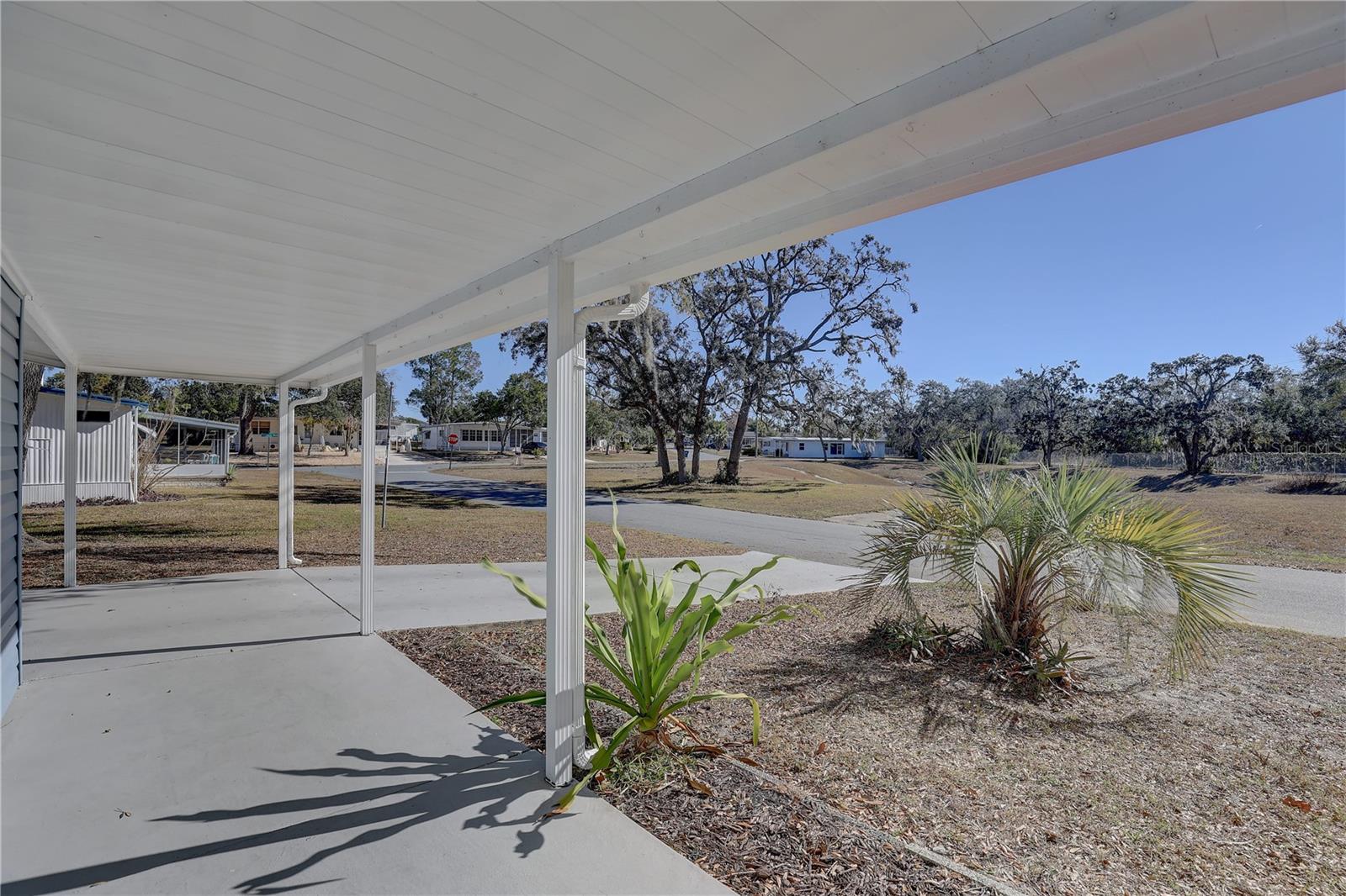 View of driveway & carport from front porch