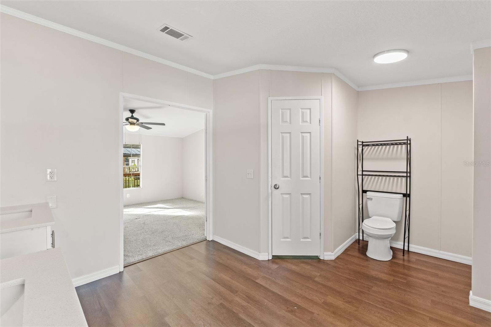 primary bathroom with large walk-in closet