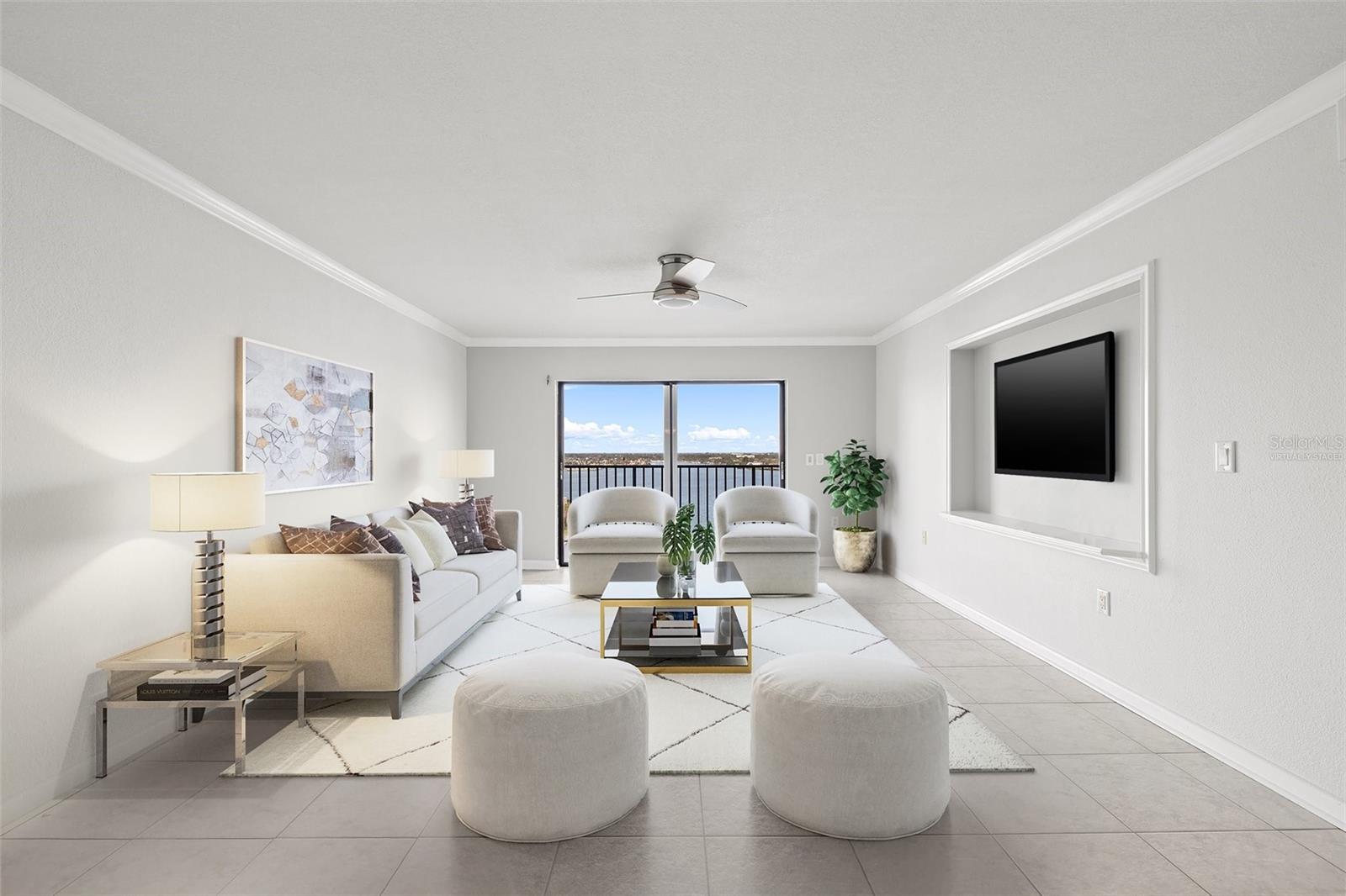 Virtually staged spacious living room with unobstructed views of Boca Ciega Bay