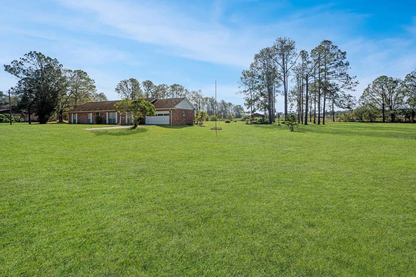 NORTH SIDE OF PROPERTY LOOKING SOUTH, STREET SIDE