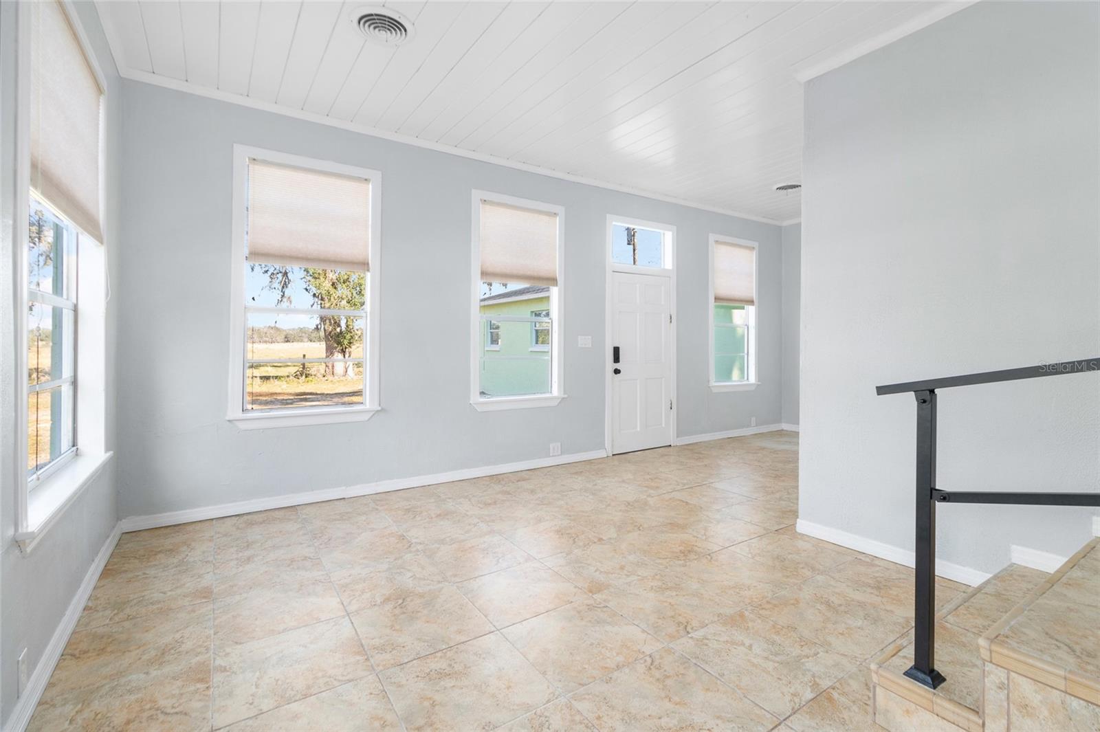 TV Room with plenty of natural sunlight, ceramic tile throughout this room