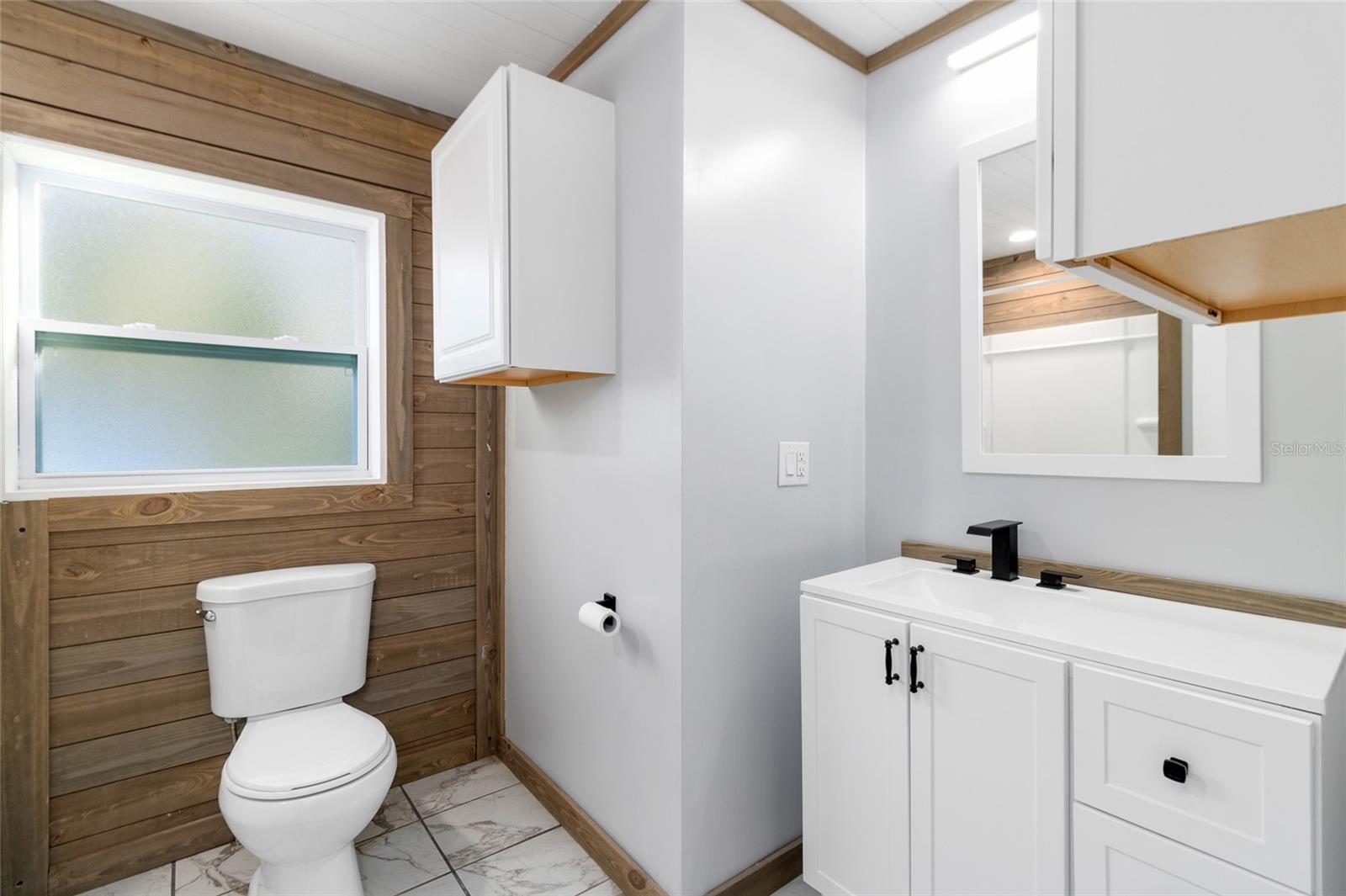 Guest Bathroom in the center of the home with a tub/shower