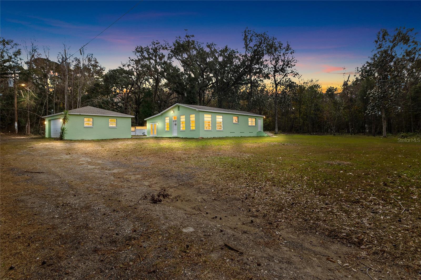 Evening view of this gorgeous home and property.