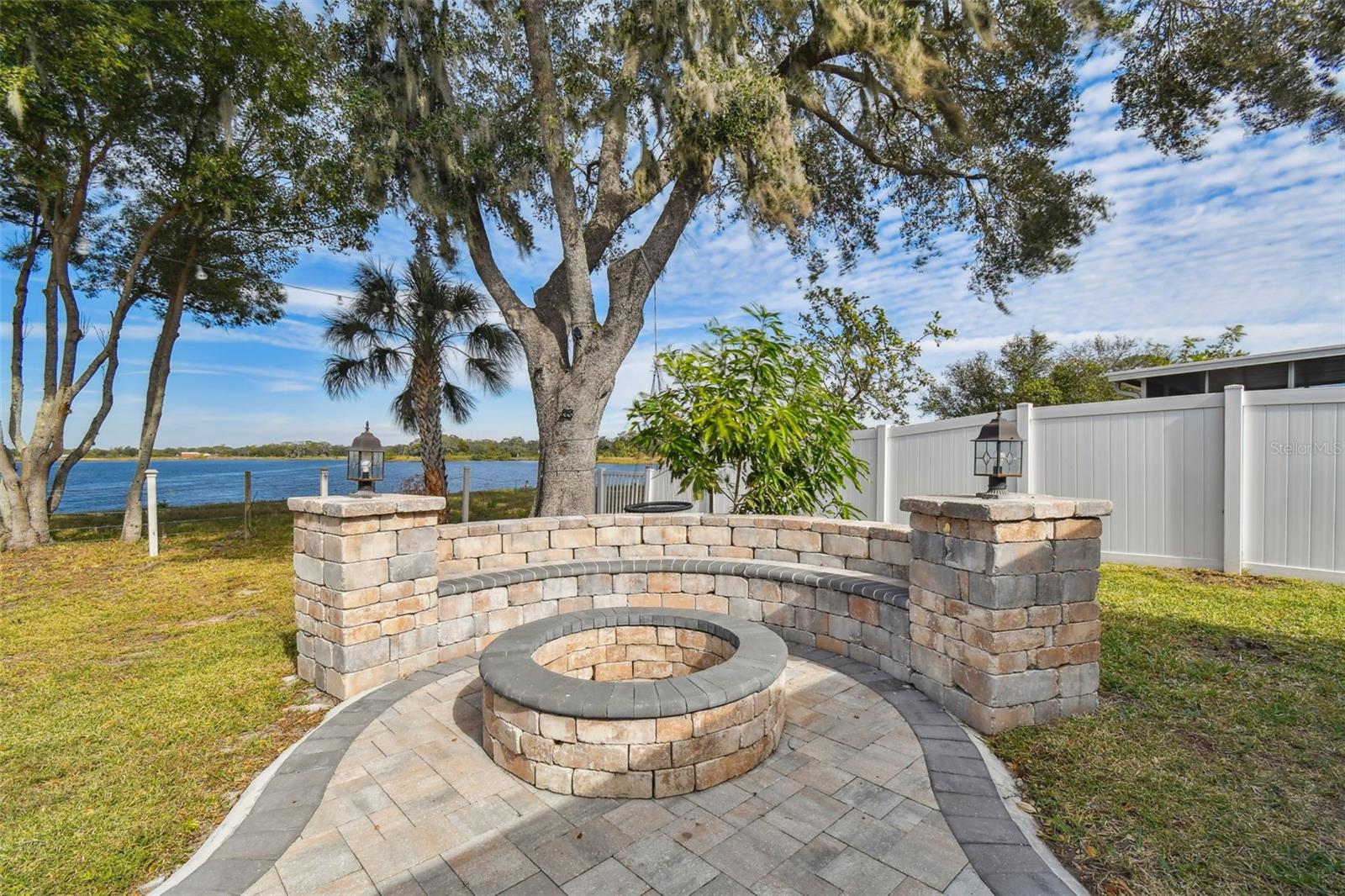 Beautiful paved area with built in fire pit and bench