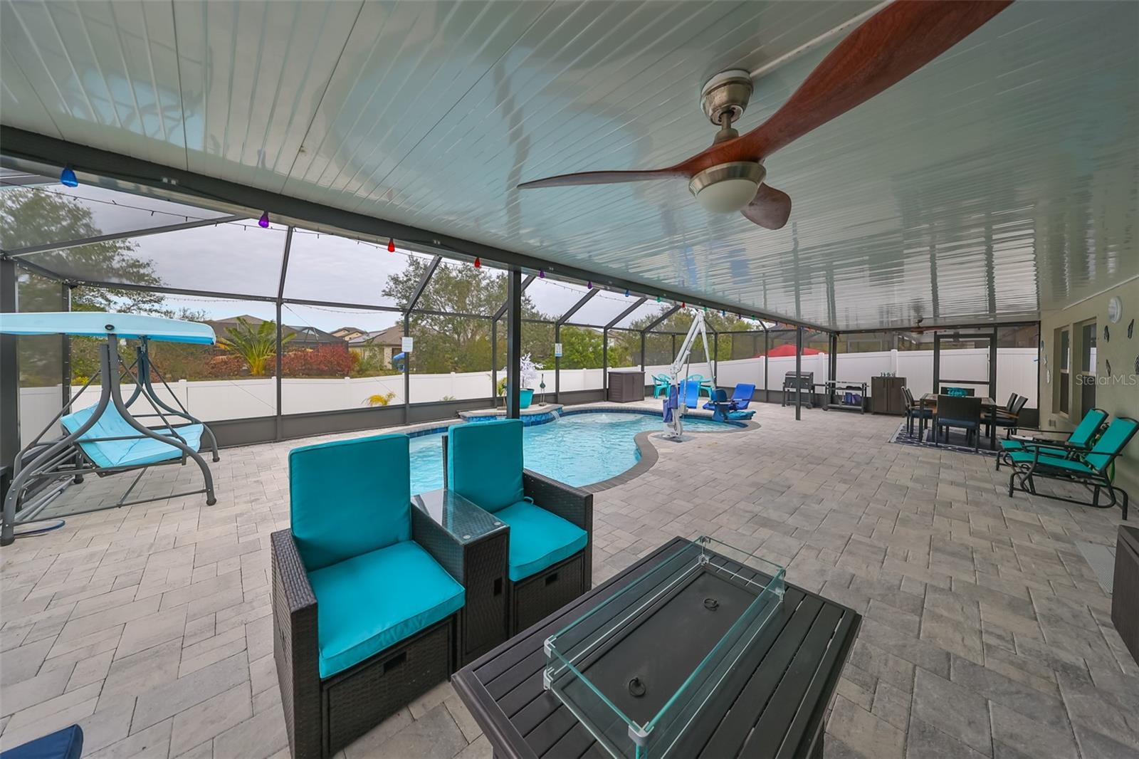 It's just big - what a perfect place to entertain! Pavers, ceiling fans, lighting, pool - amazing!