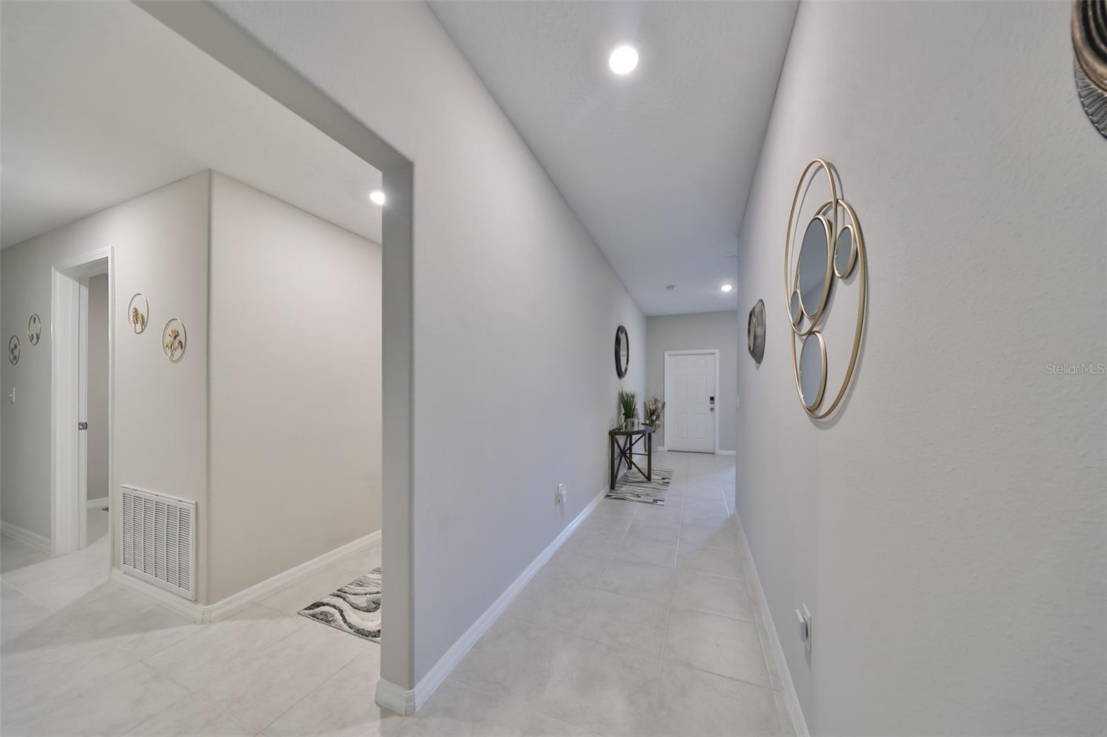 In-law suite to the far left, laundry room left, left hallway to garage, center hallway to Foyer