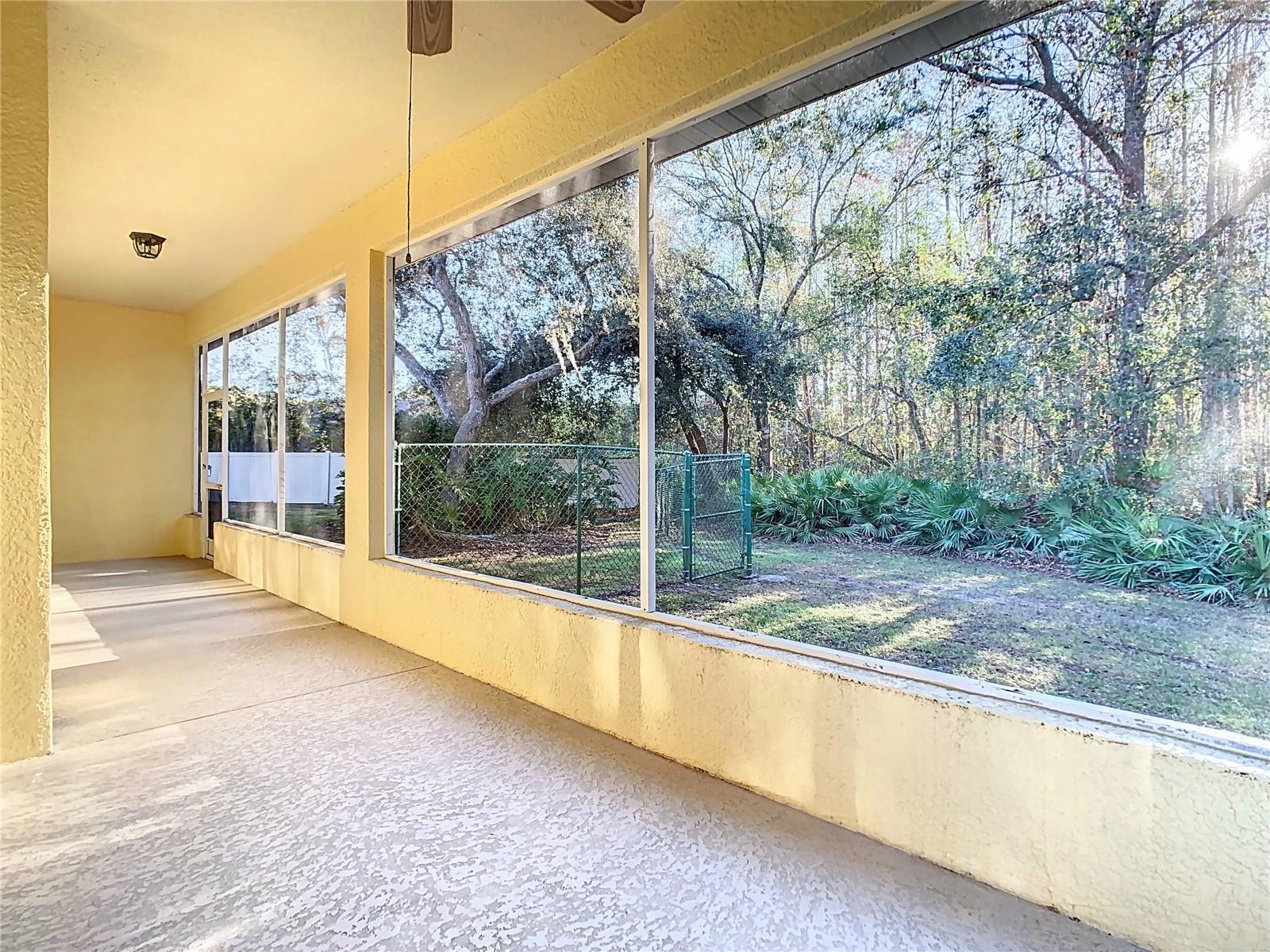 Escape to your own private oasis on this expansive 36-foot screened porch overlooking the peaceful conservation area.