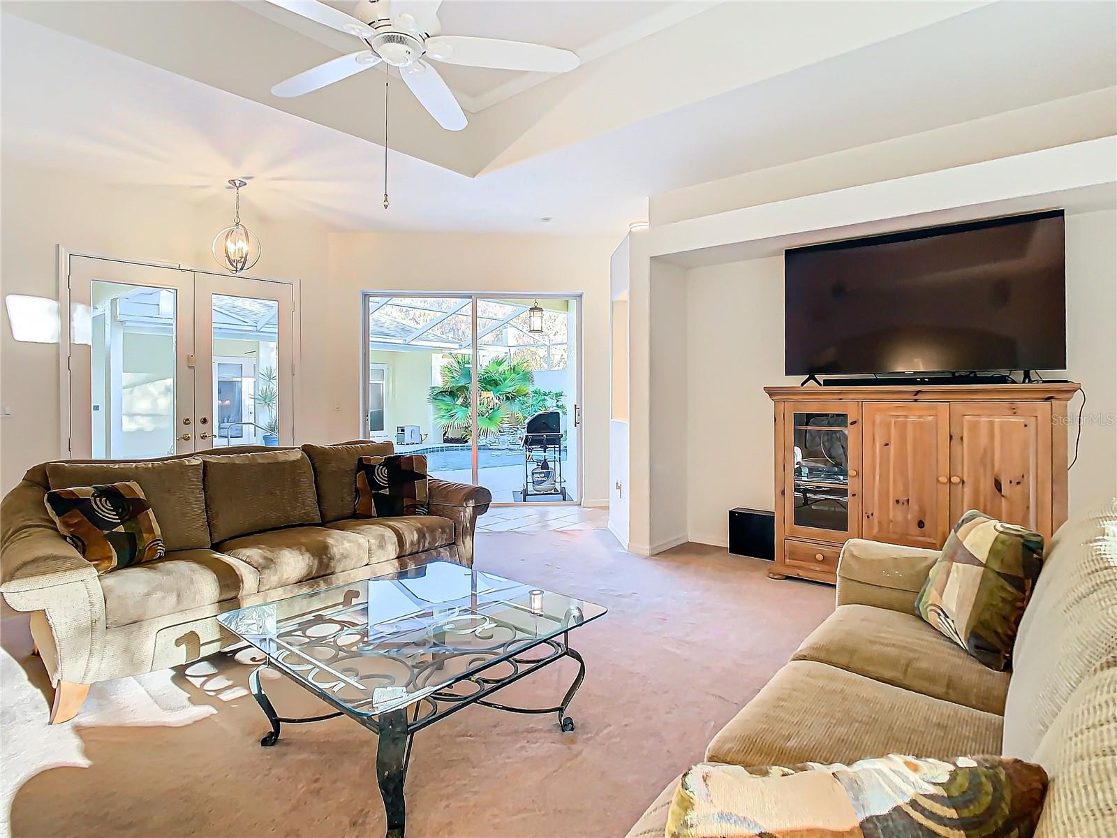 Bathed in natural light from the courtyard and backyard, this open living area is bright and welcoming