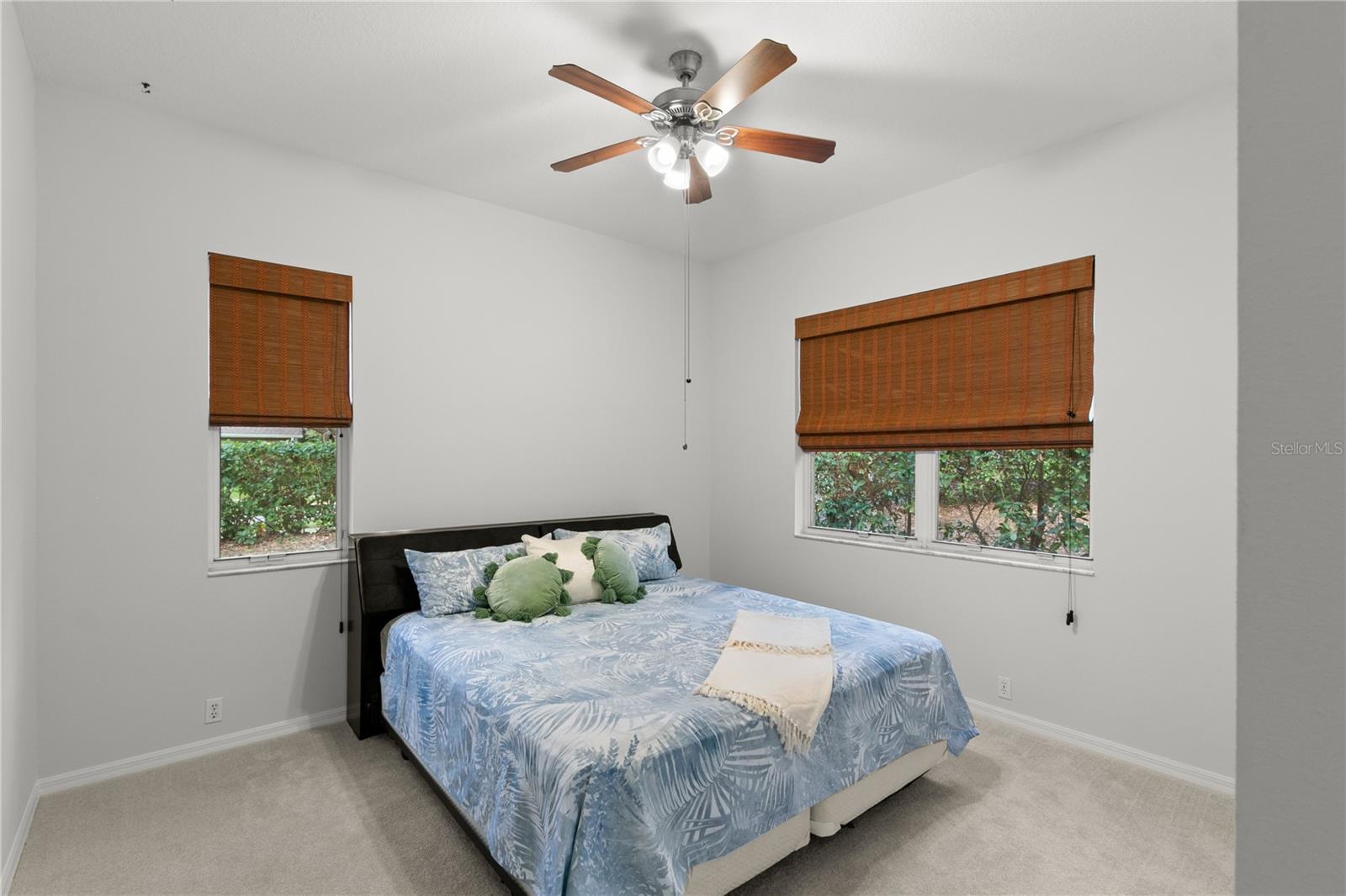 Corner bedroom overlooks back yard