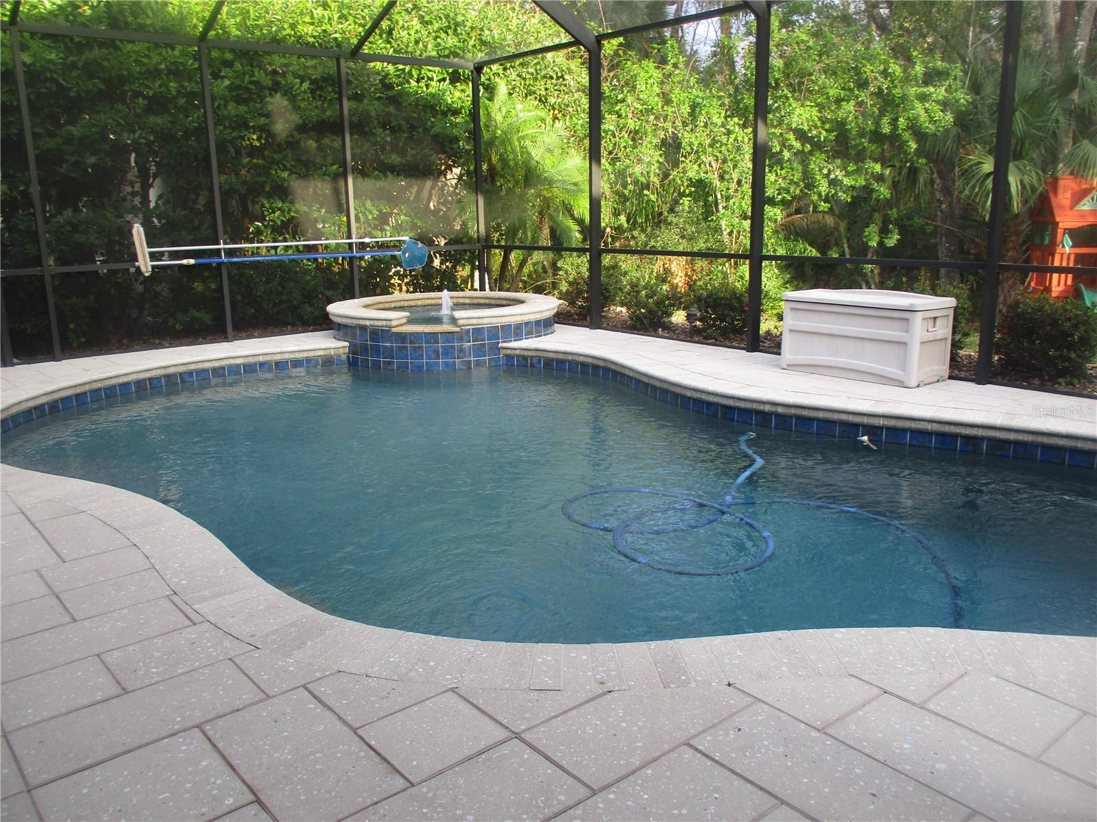 Solar heated pool with spa